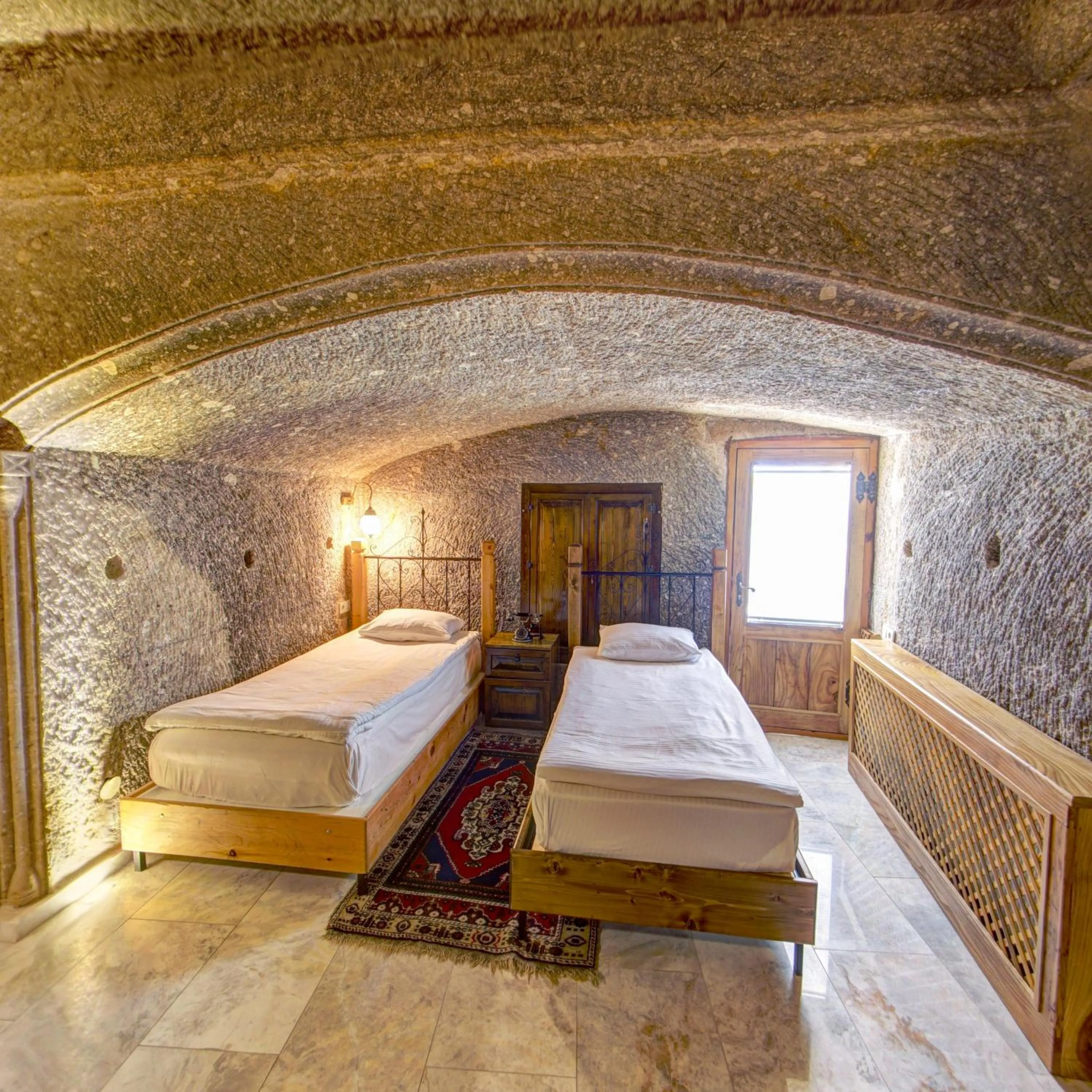 Bed in Roma Cave Suite