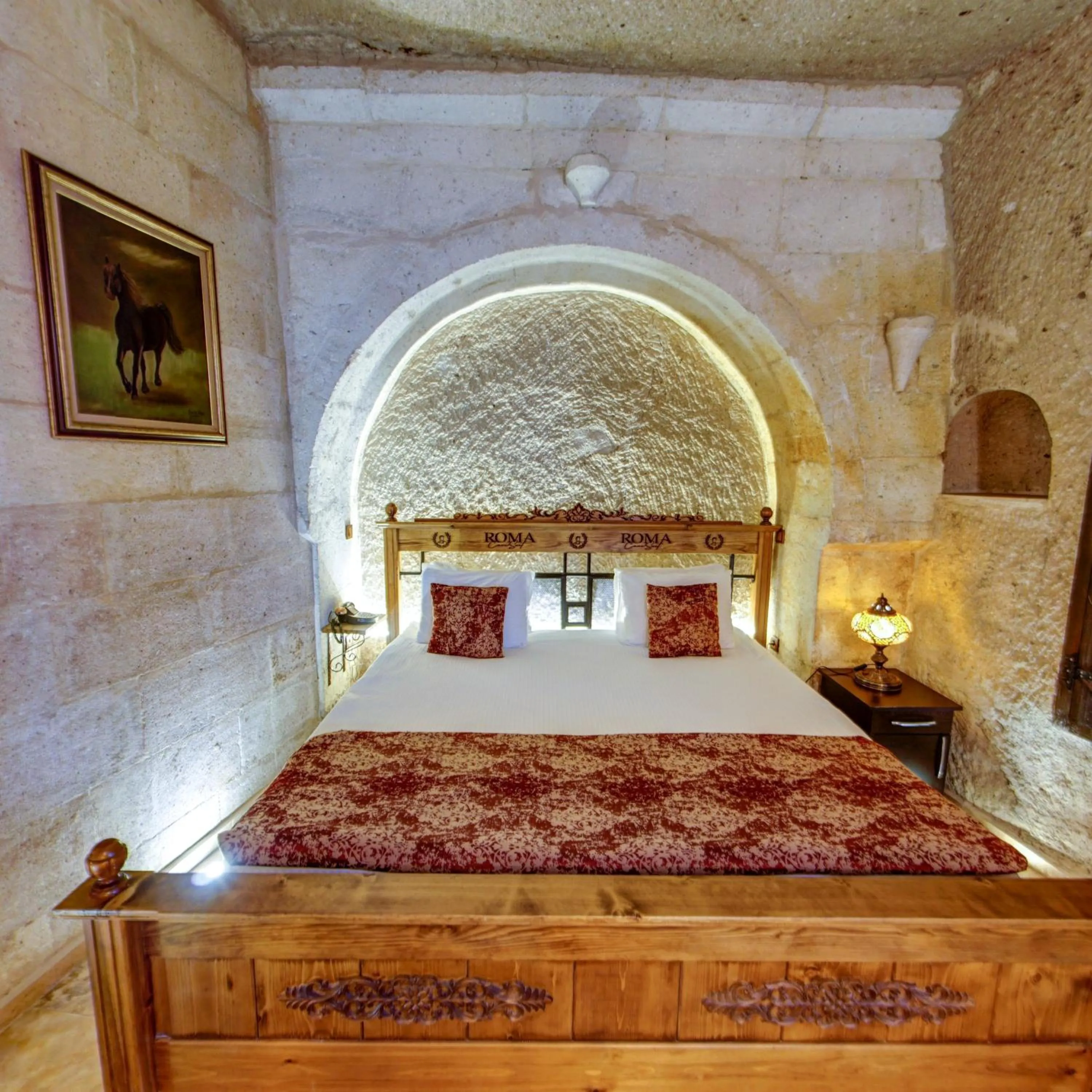 Bed in Roma Cave Suite