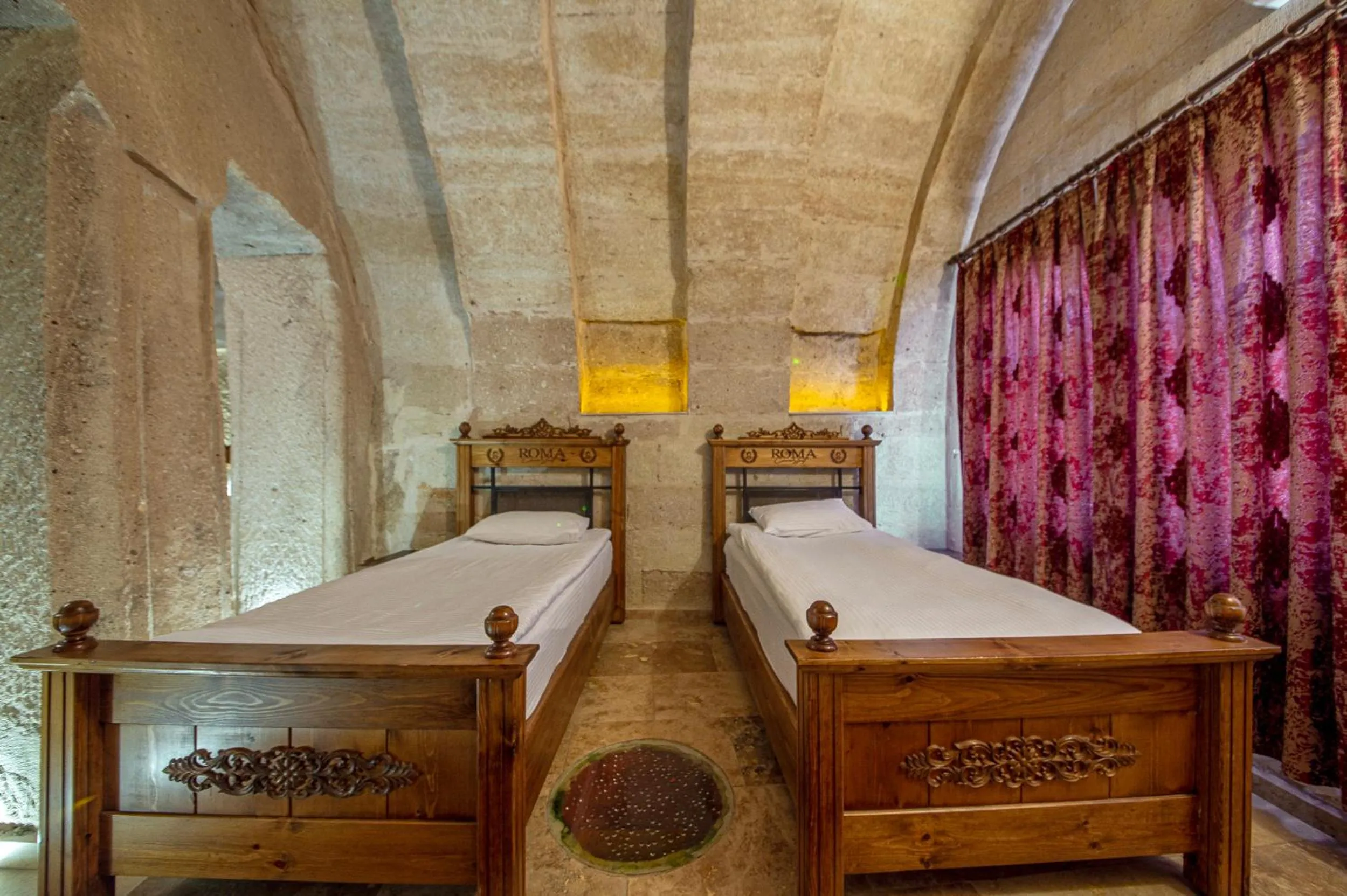 Bed in Roma Cave Suite