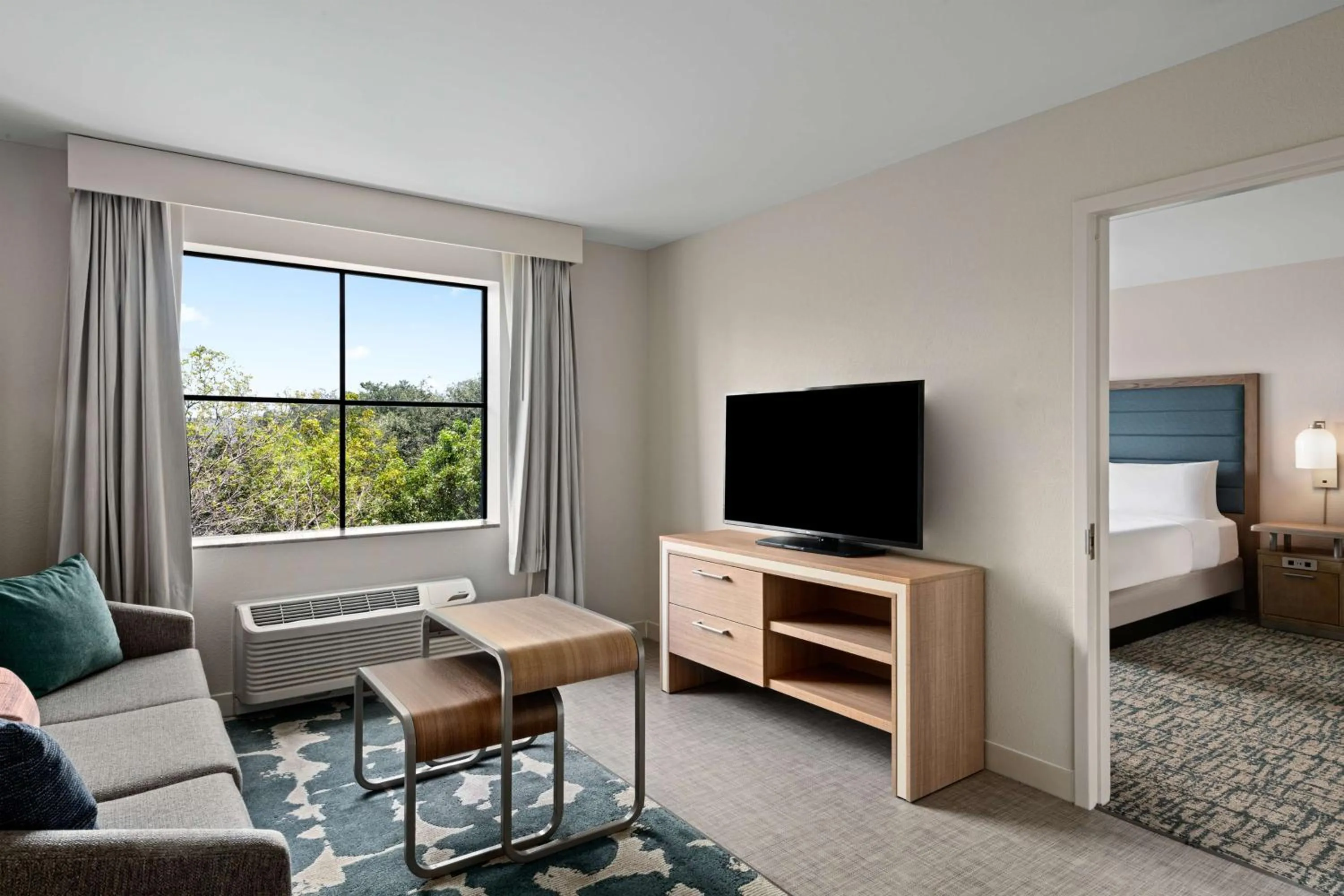 Living room, Bed in Homewood Suites by Hilton West Palm Beach