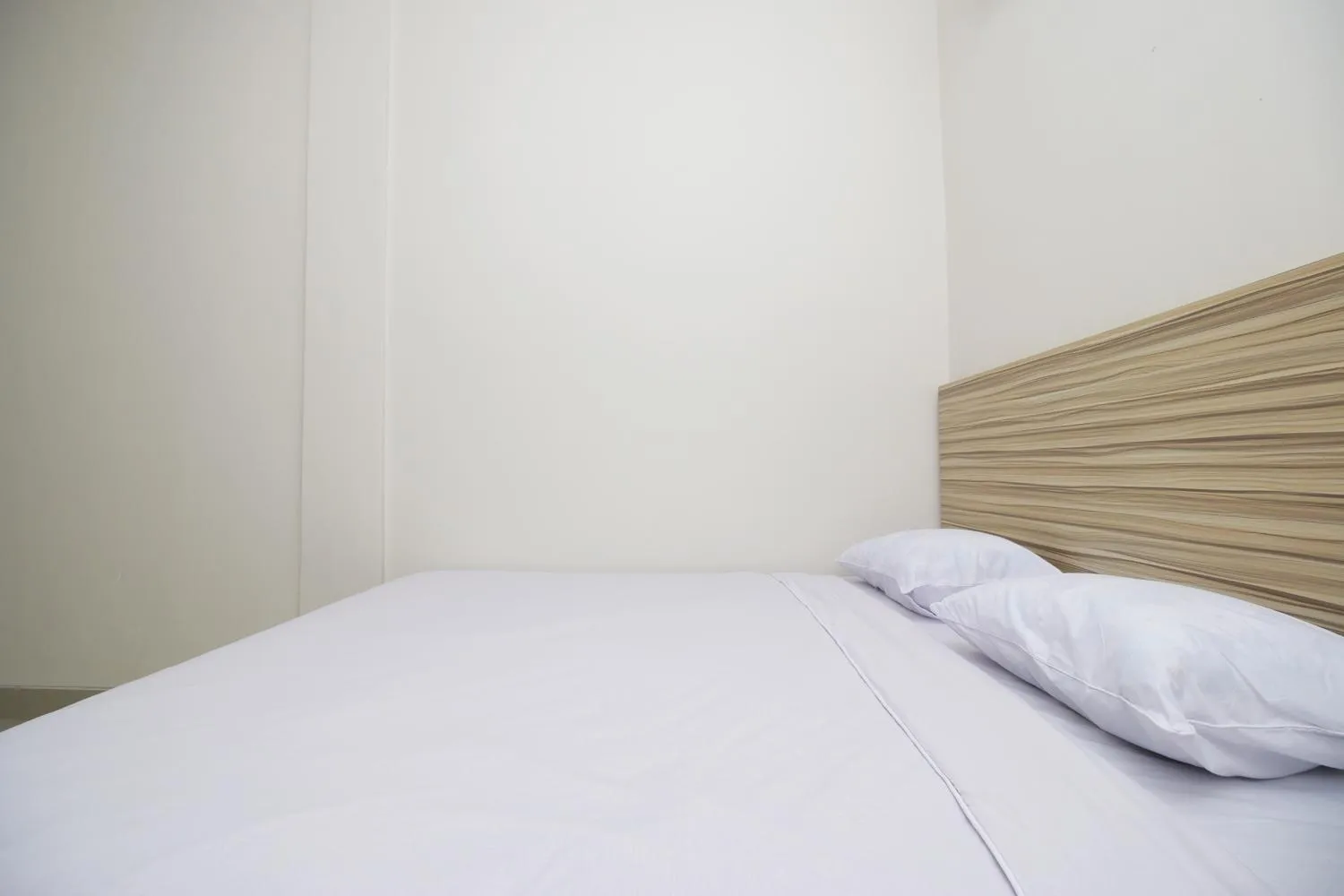 Bed in RedDoorz near Jalan Kolonel Haji Burlian Palembang