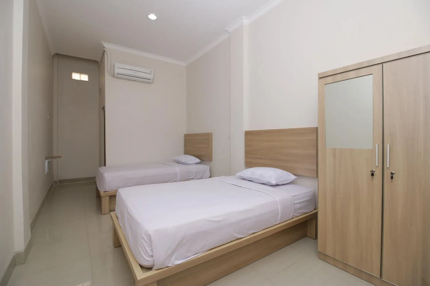 Bed in RedDoorz near Jalan Kolonel Haji Burlian Palembang