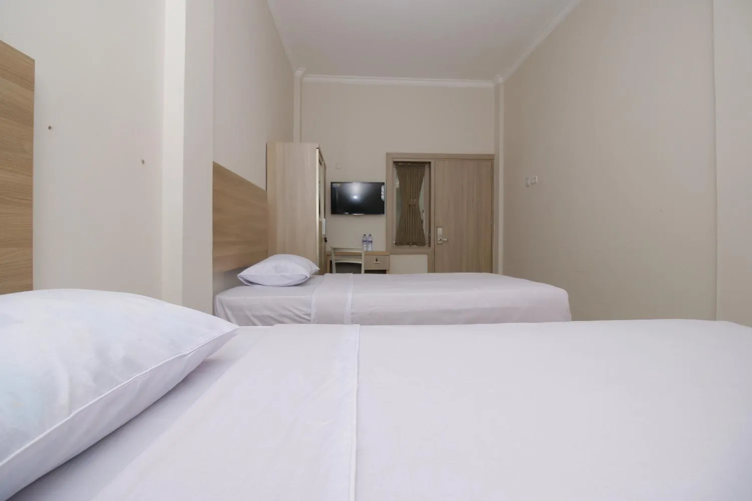 Bed in RedDoorz near Jalan Kolonel Haji Burlian Palembang