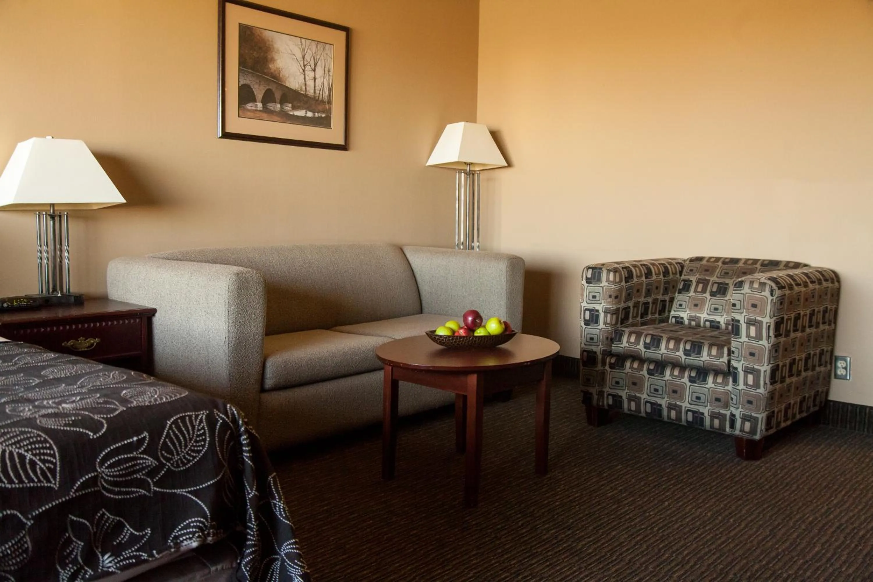 Seating area, Bed in Medicine Hat Lodge, Trademark Collection by Wyndham