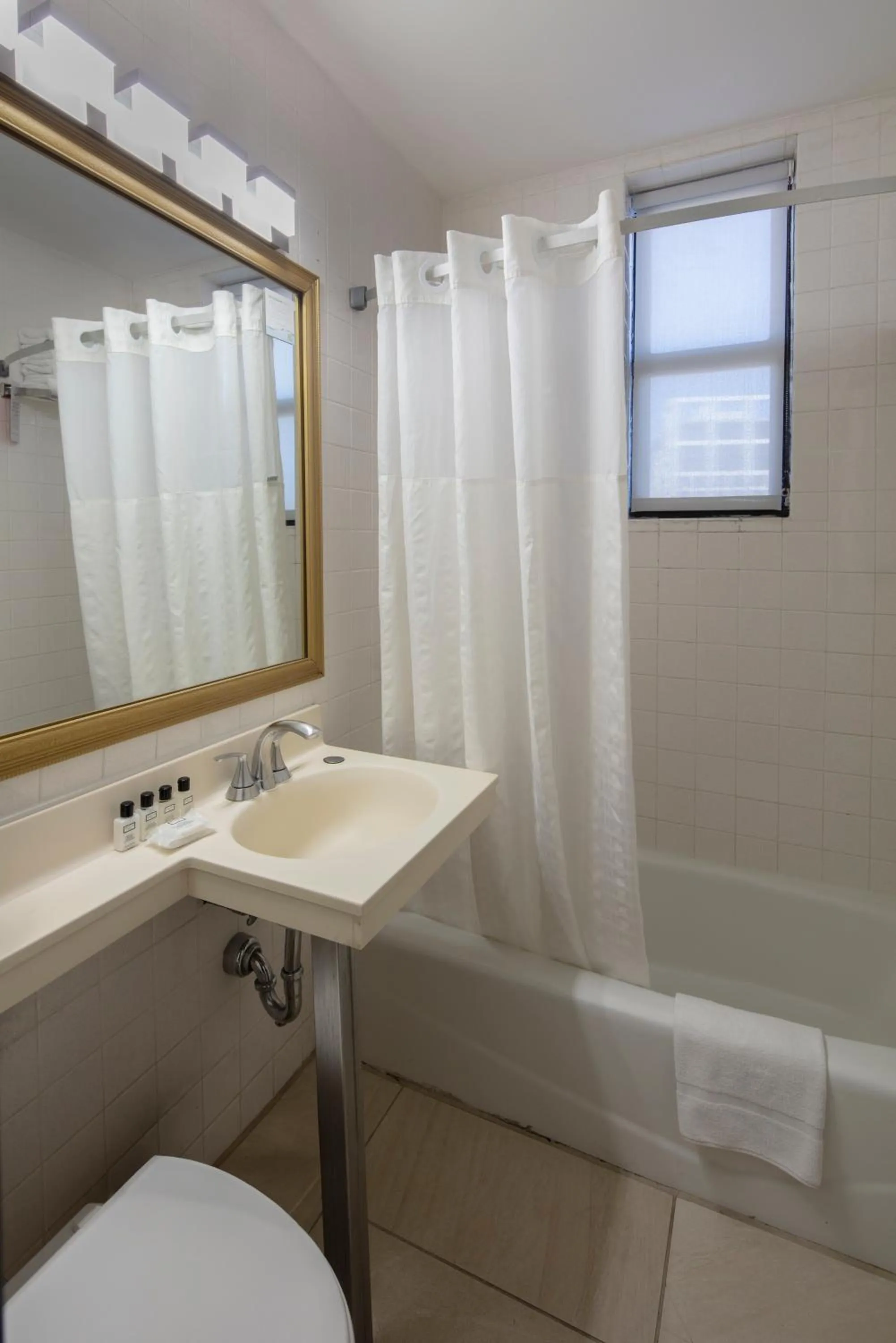Bathroom in Ramada by Wyndham Jersey City