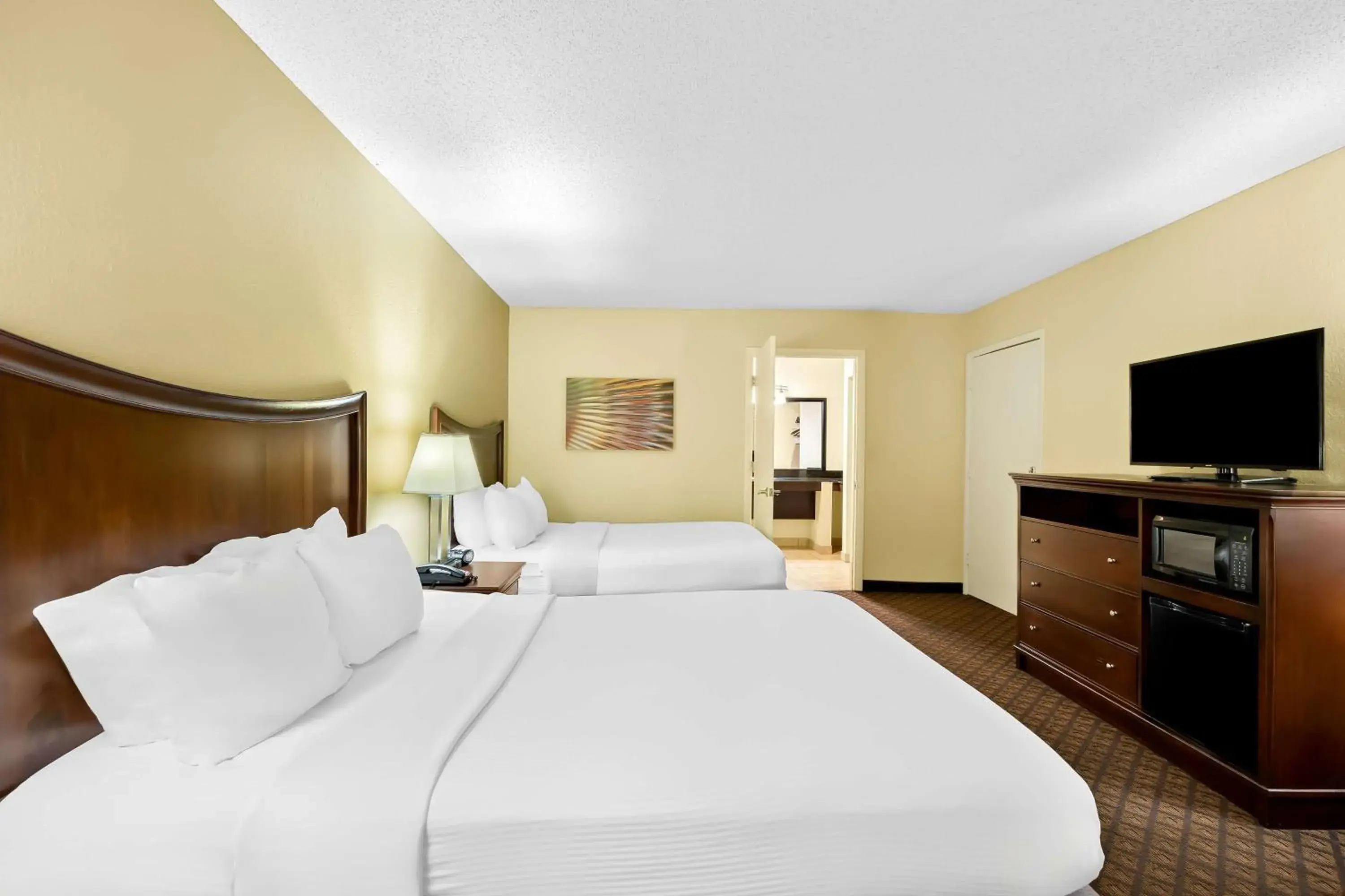 Queen Room with Two Queen Beds with Roll-In Shower in Best Western Coach House Queen Room with Two Queen Beds with Roll-In Shower in Best Western Coach House