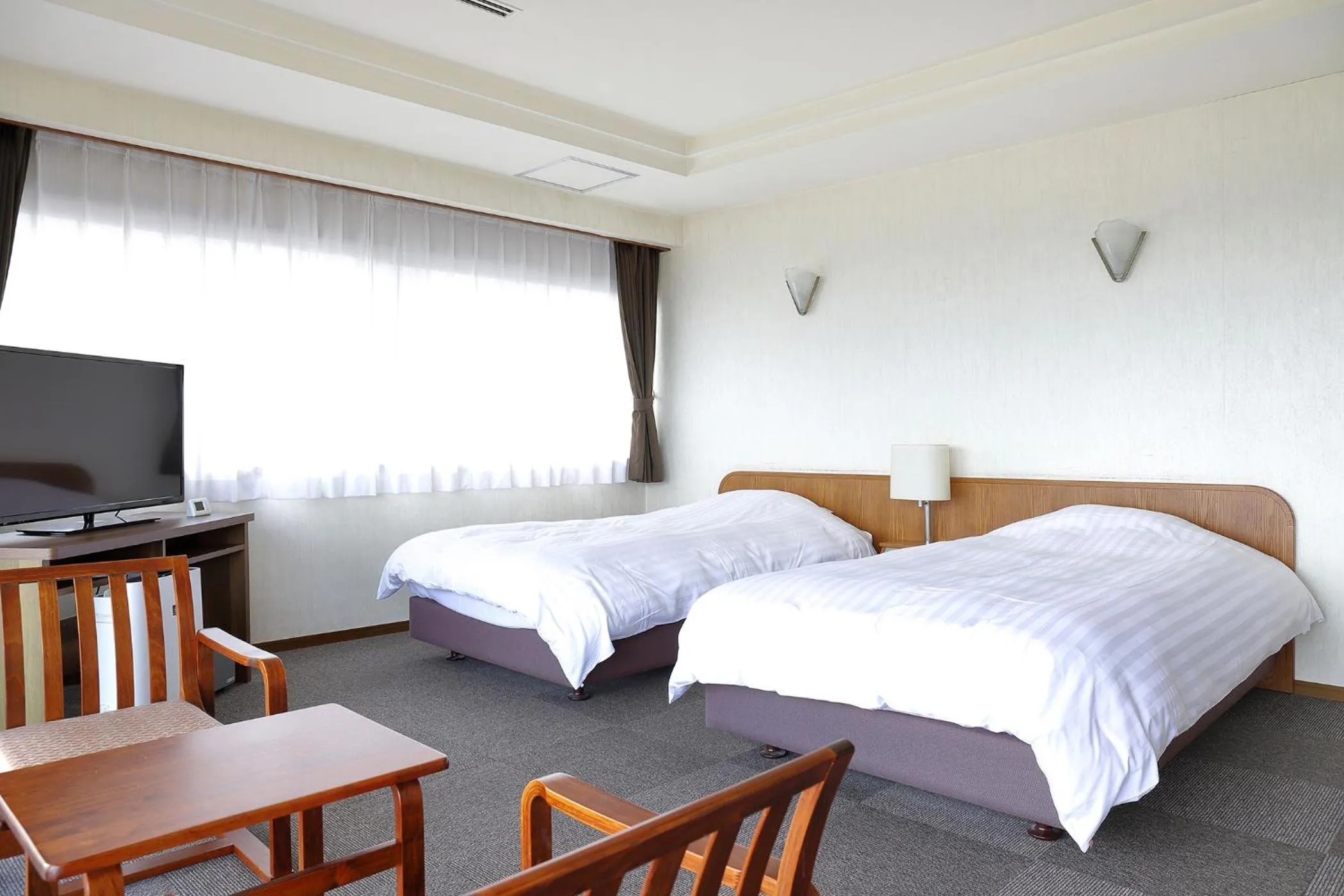 Bed in Ooedo Onsen Monogatari Beppu Seifu