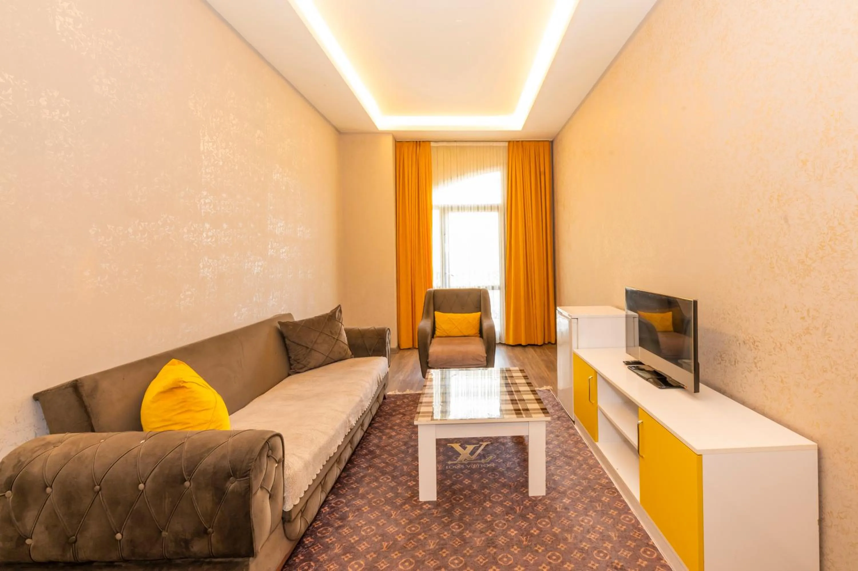 Communal lounge/ TV room, Bed in Agora Suites