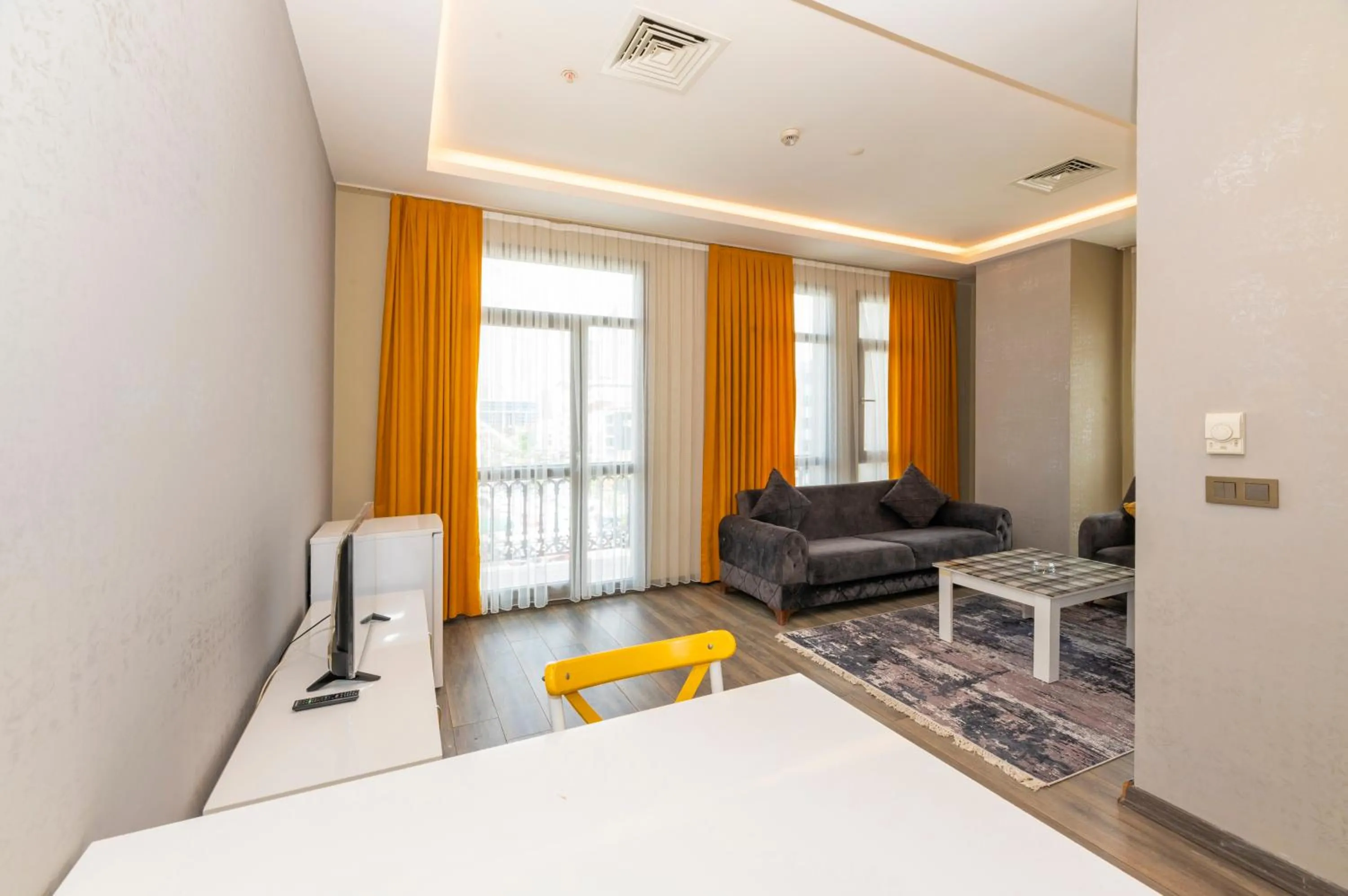 Seating area, Bed in Agora Suites
