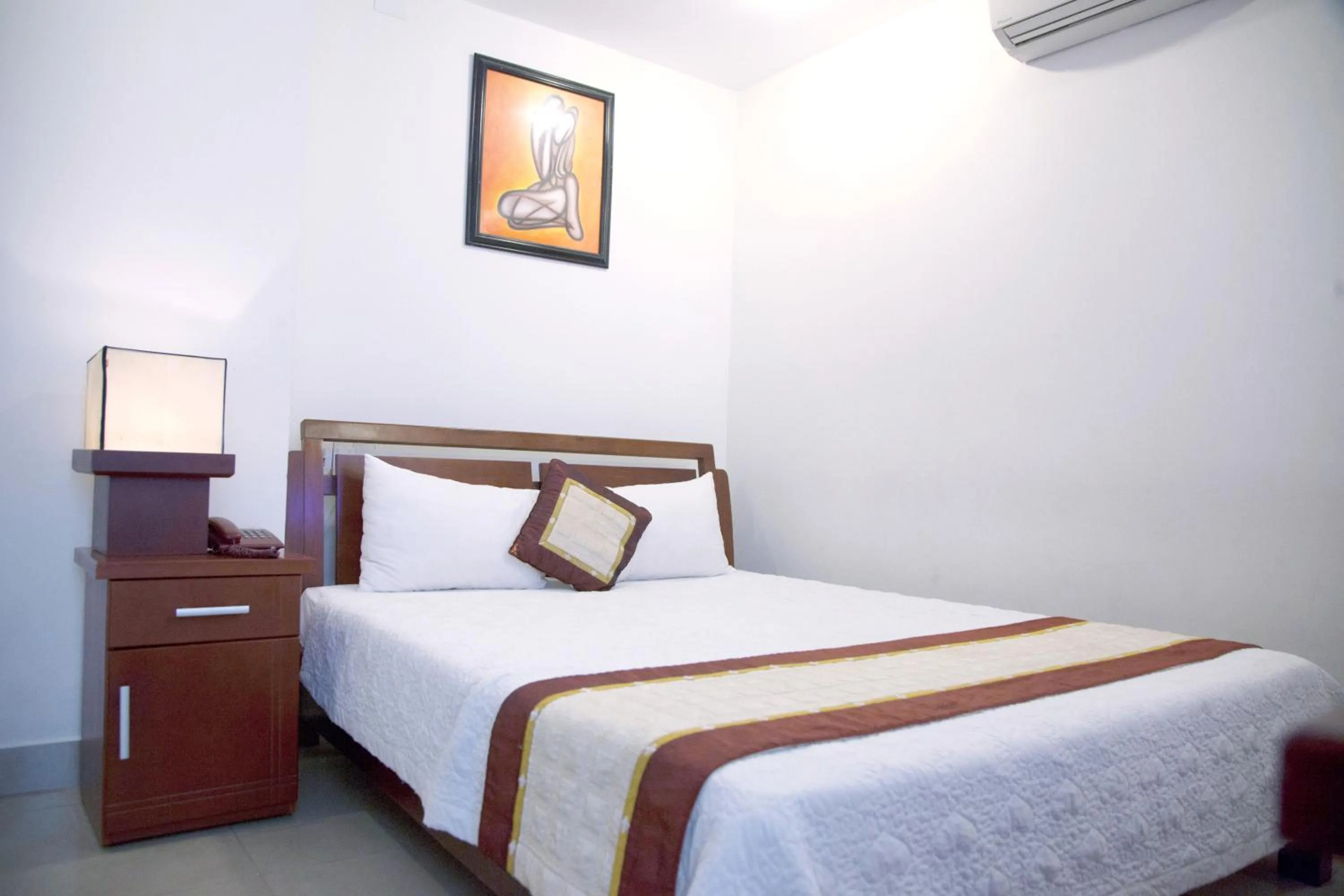 Bed in Hoang Thuy Sinh Hotel