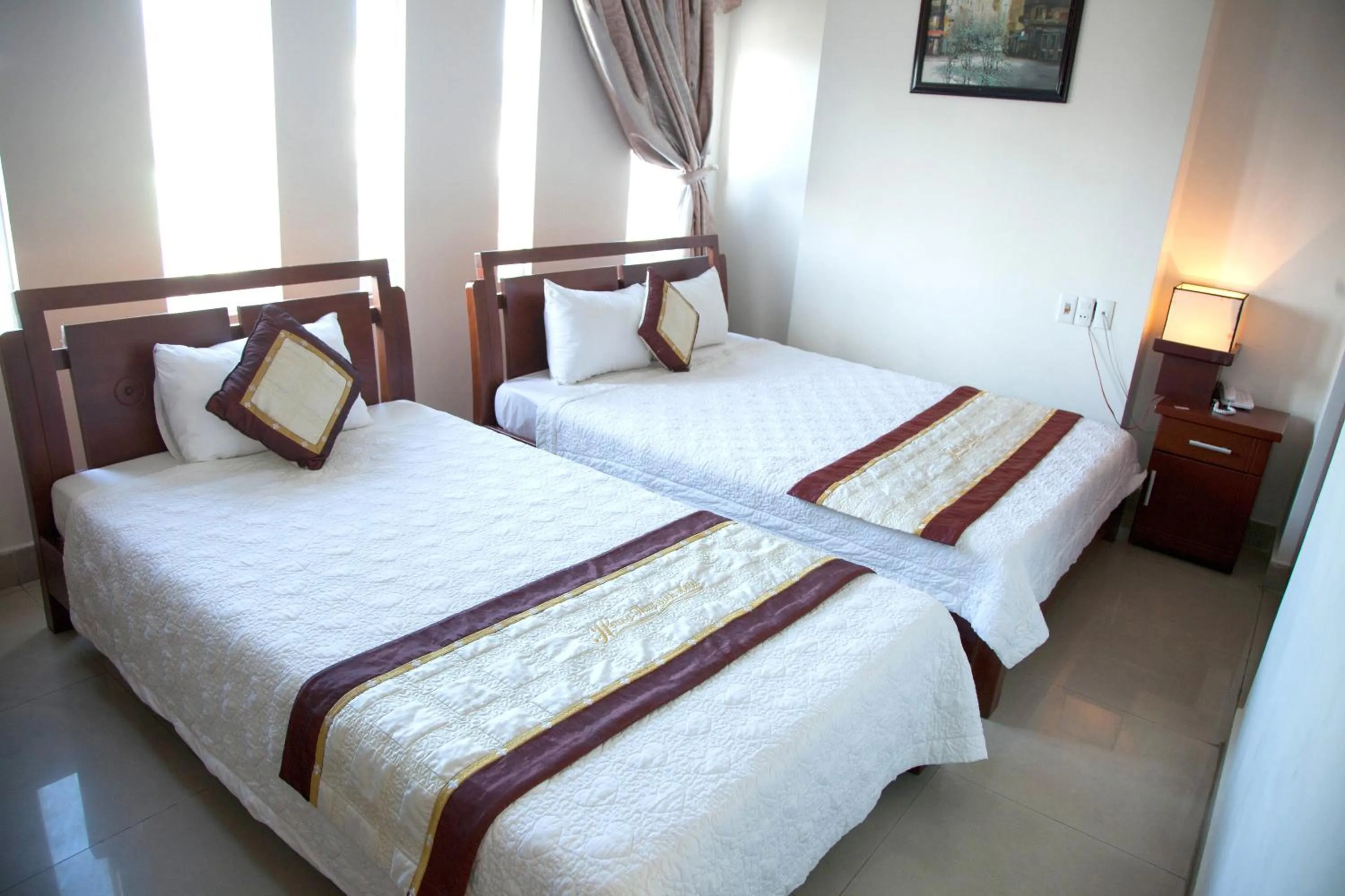 Bed in Hoang Thuy Sinh Hotel