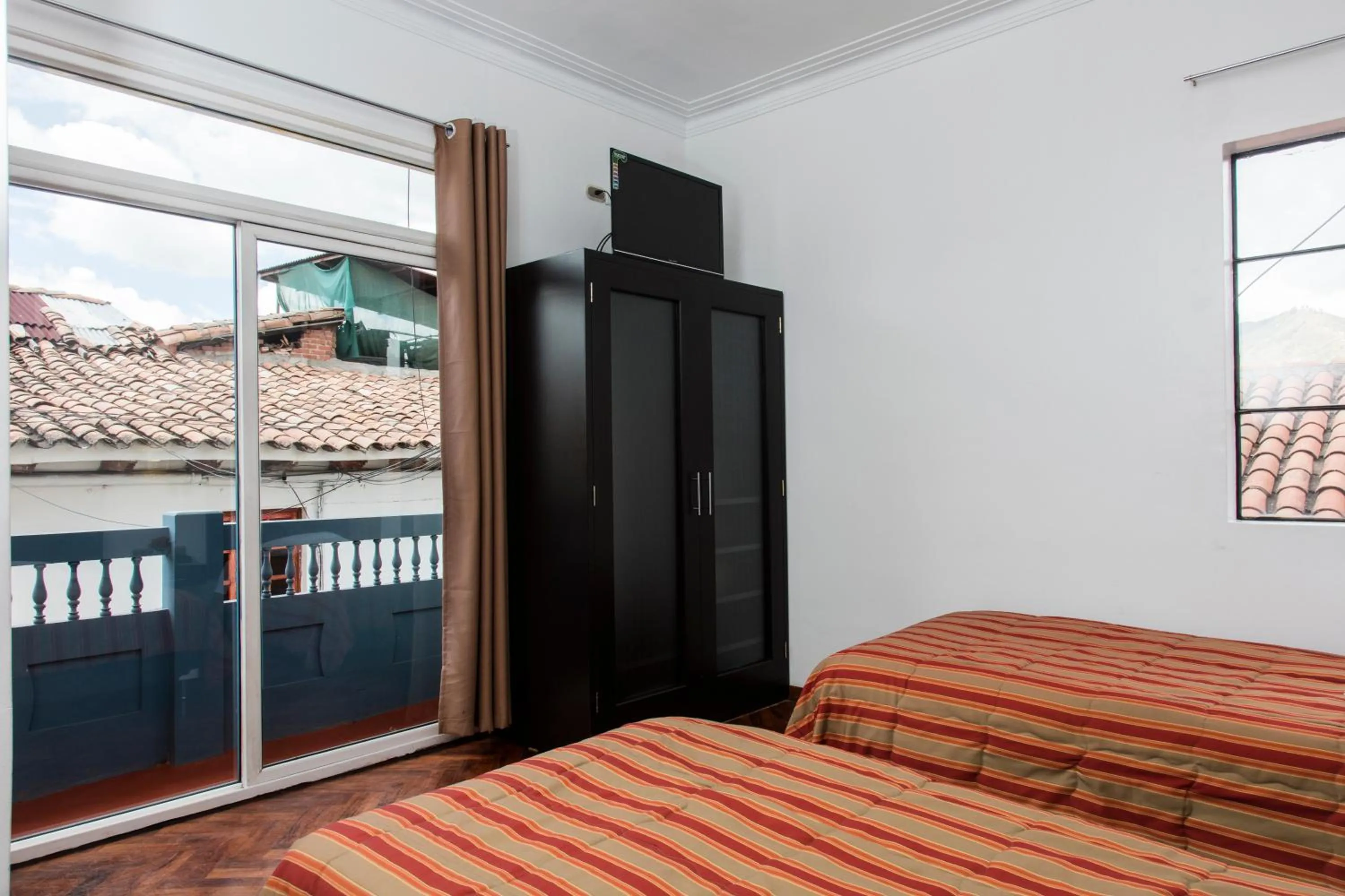 Photo of the whole room, Bed in Hostal & Apartments El Triunfo