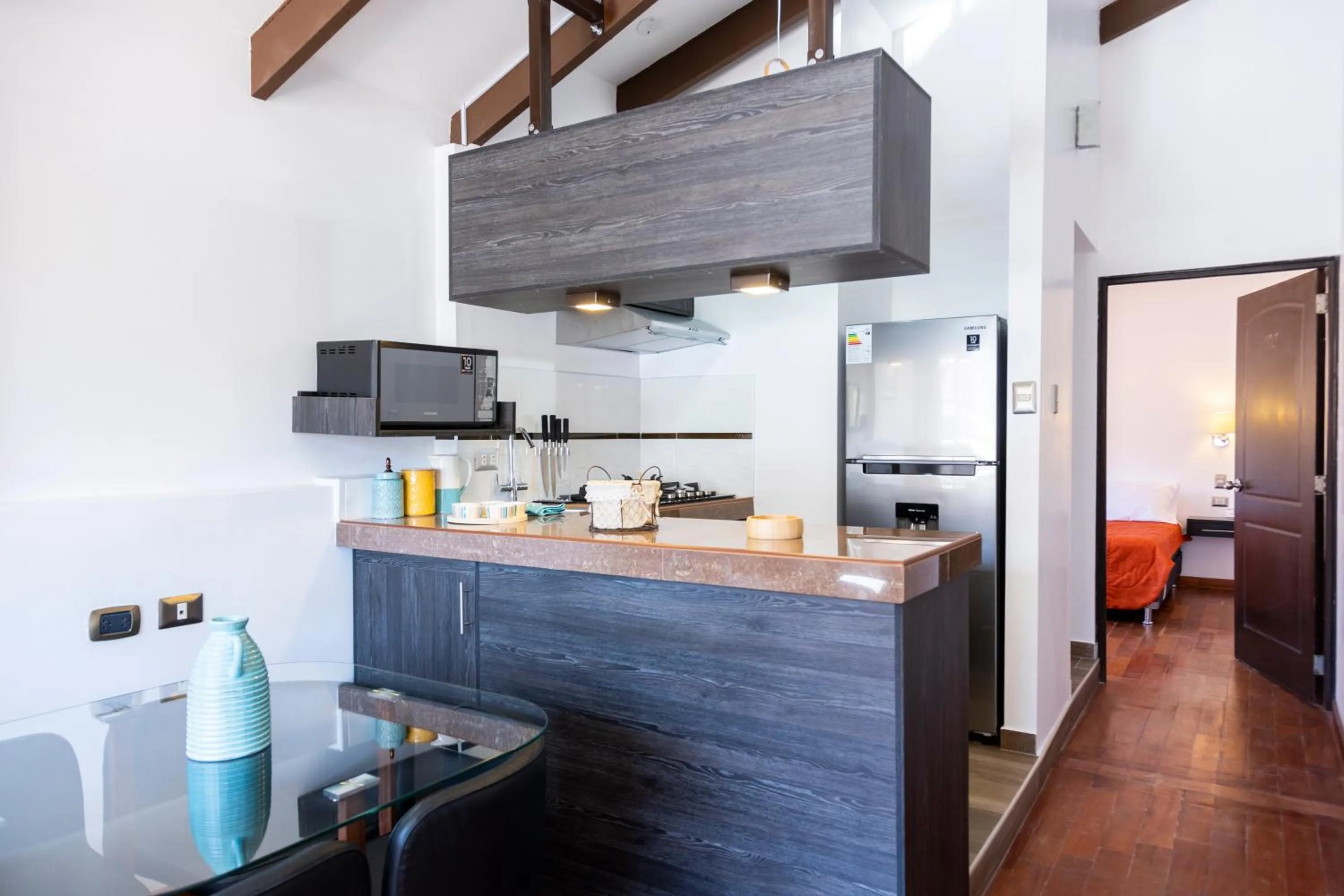 Kitchen or kitchenette in Hostal & Apartments El Triunfo