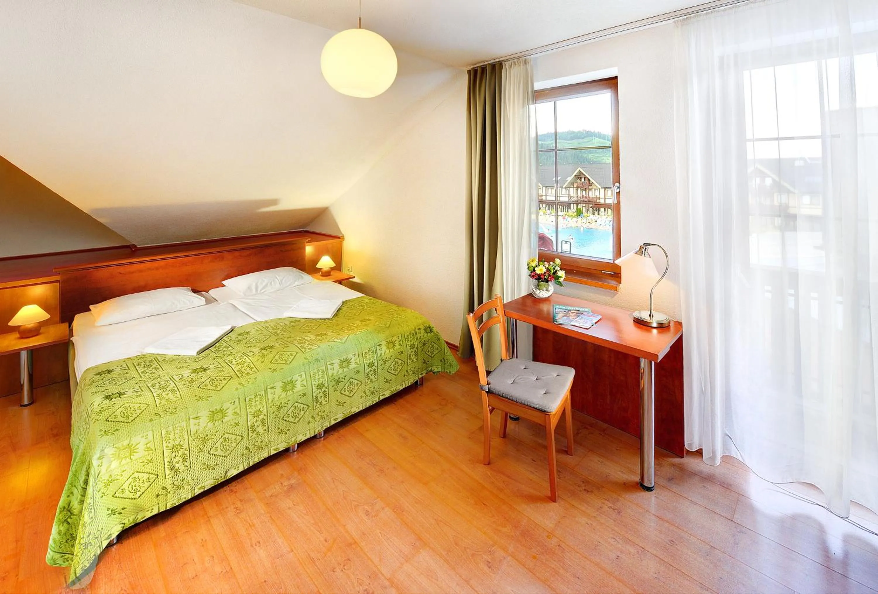 Bathroom, Bed in Hotel Bešeňová