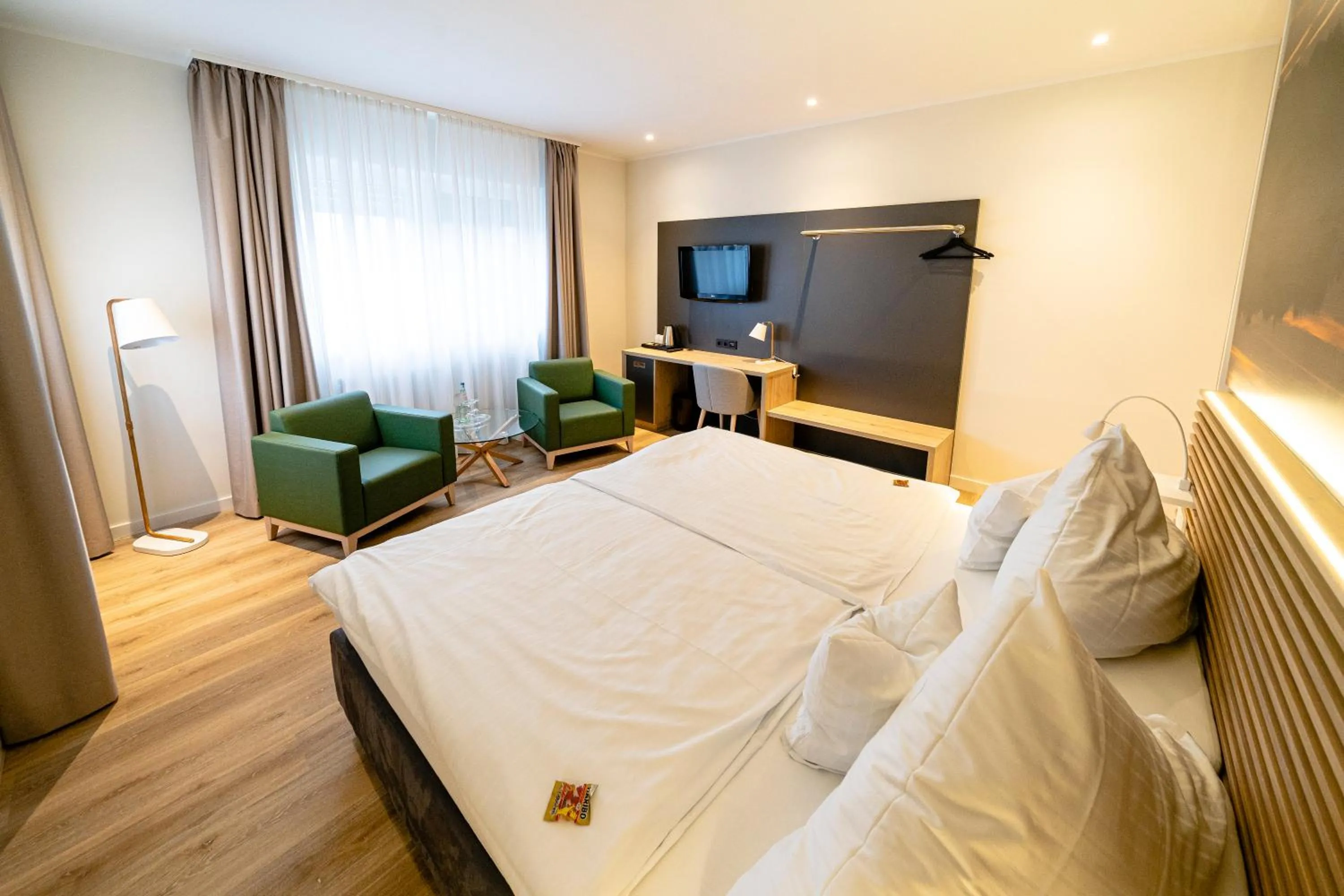 Communal lounge/ TV room, Bed in Hotel Restaurant Kloppendiek