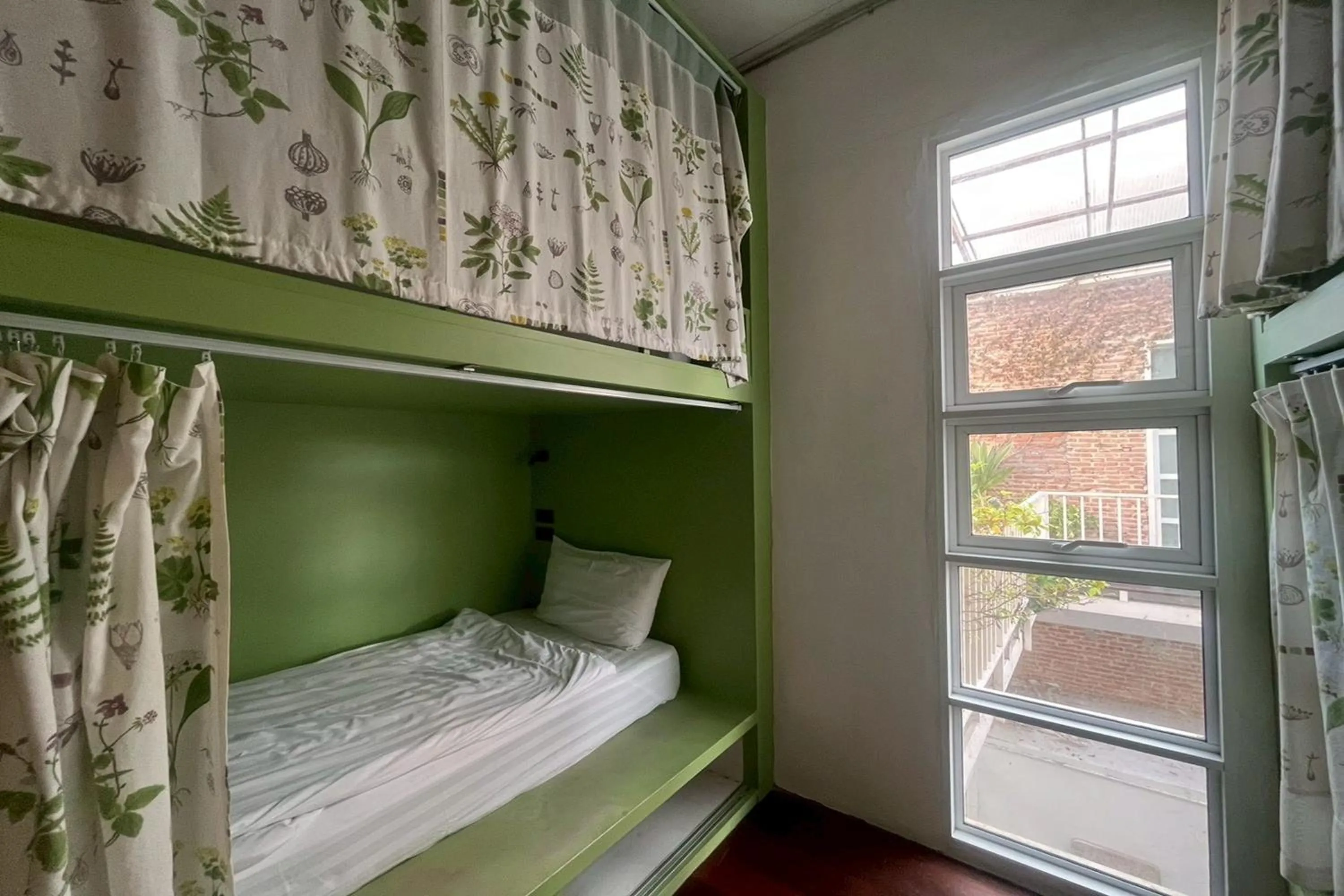 Photo of the whole room, Bed in Memmoth Cafe & Hostel in Lampang