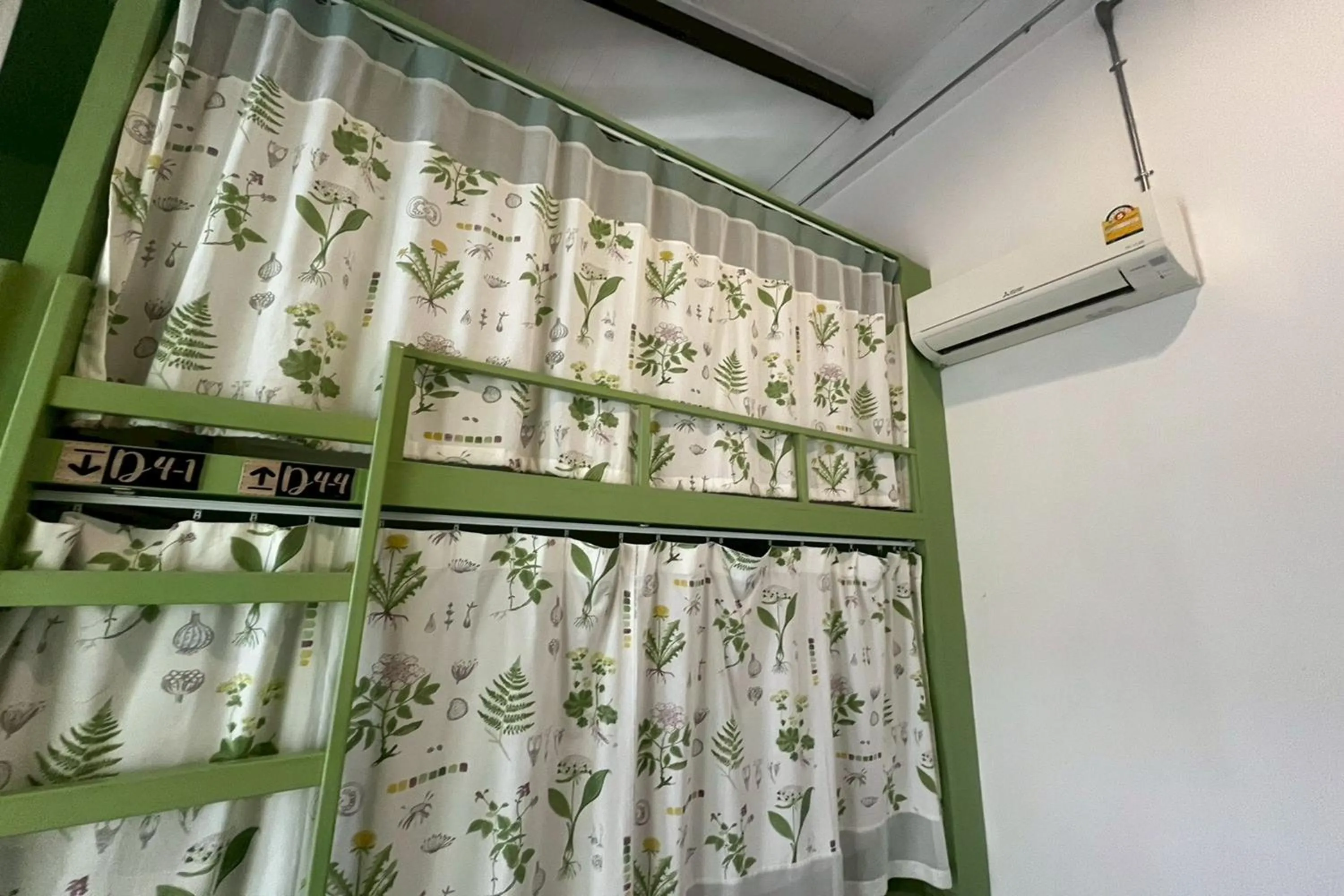 Photo of the whole room in Memmoth Cafe & Hostel in Lampang