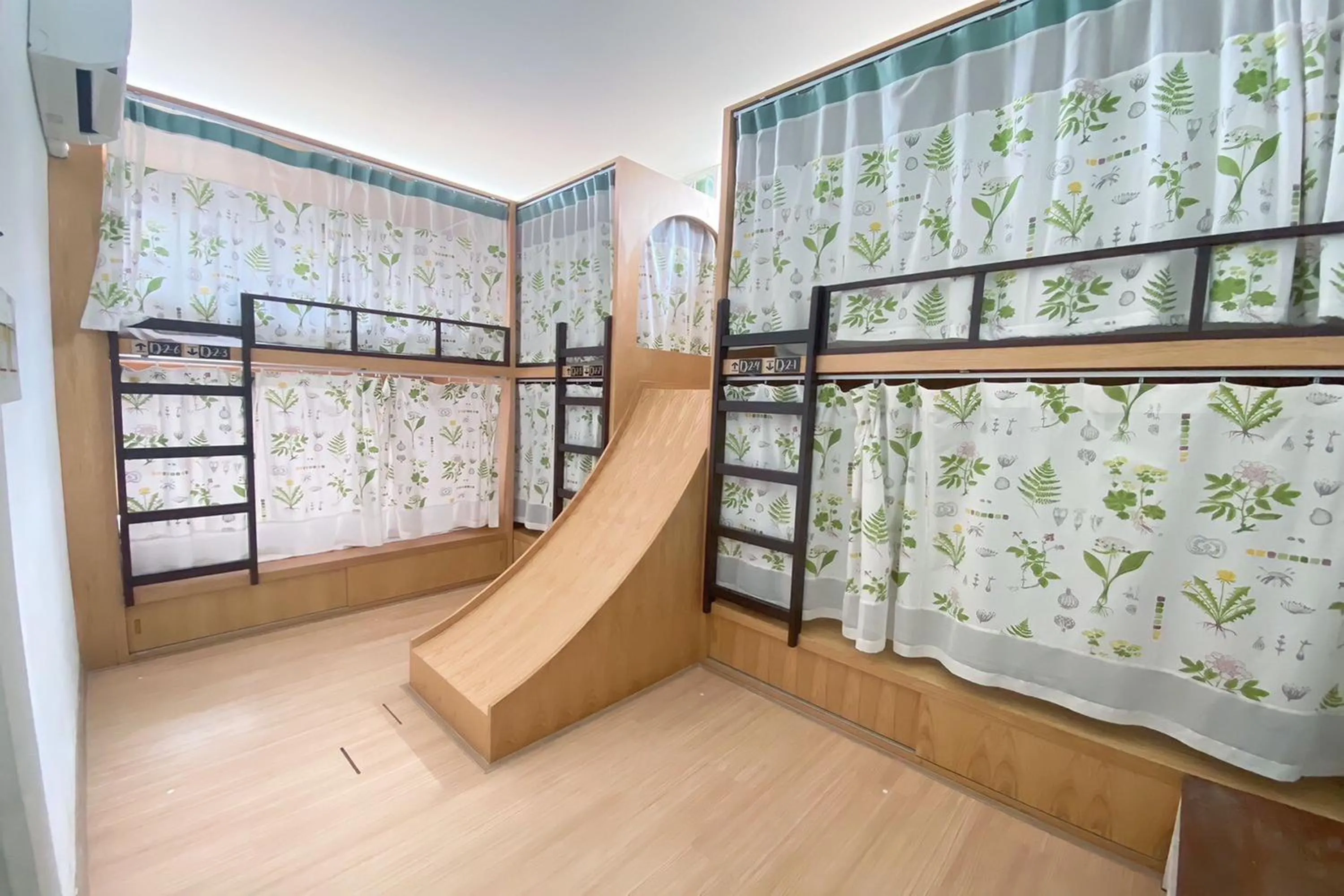 Photo of the whole room in Memmoth Cafe & Hostel in Lampang