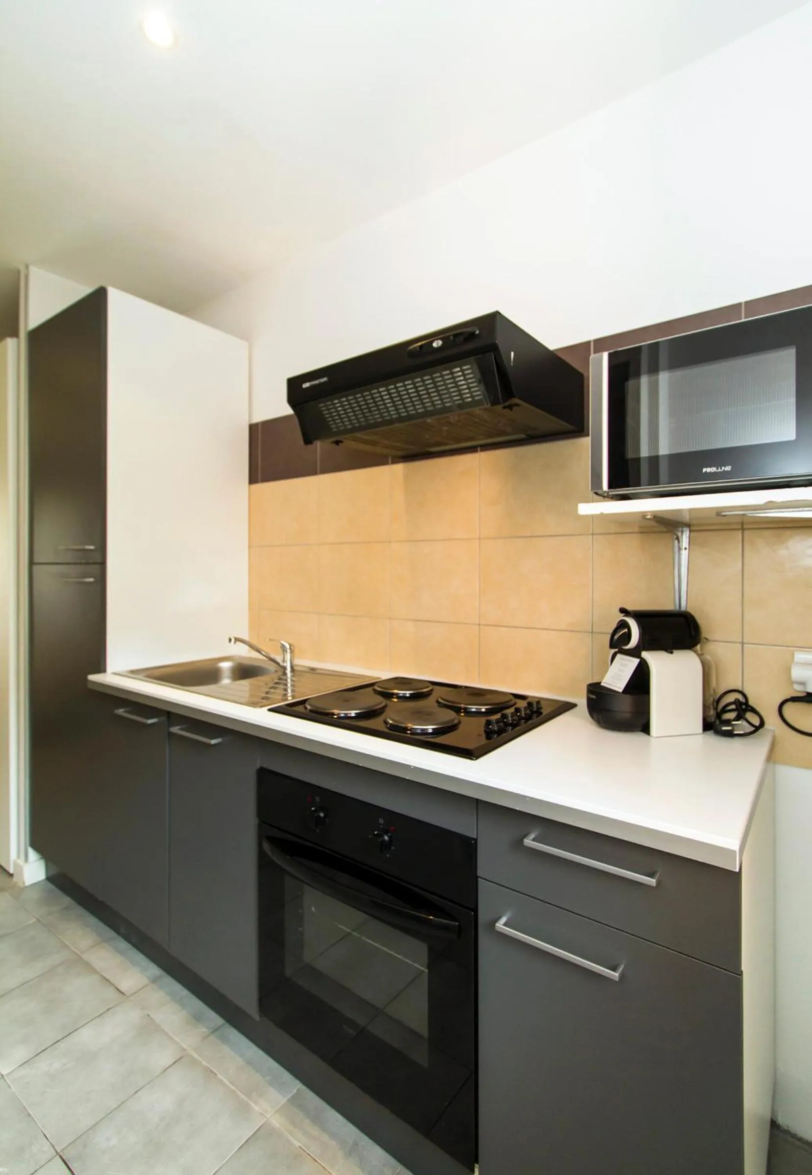 Kitchen or kitchenette in Florella Achard Apartment