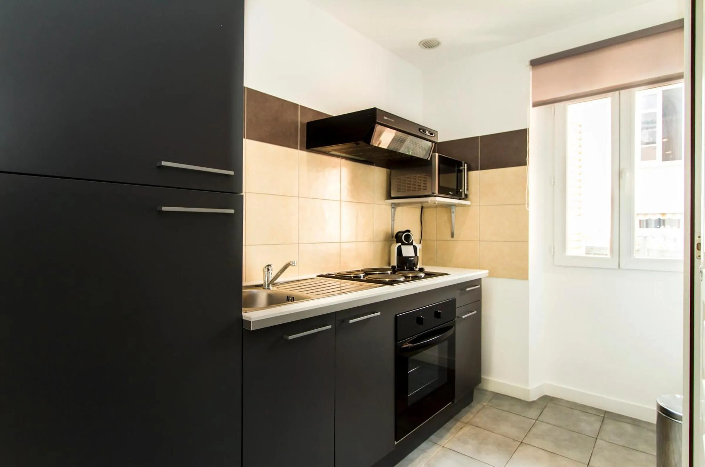 Kitchen or kitchenette in Florella Achard Apartment