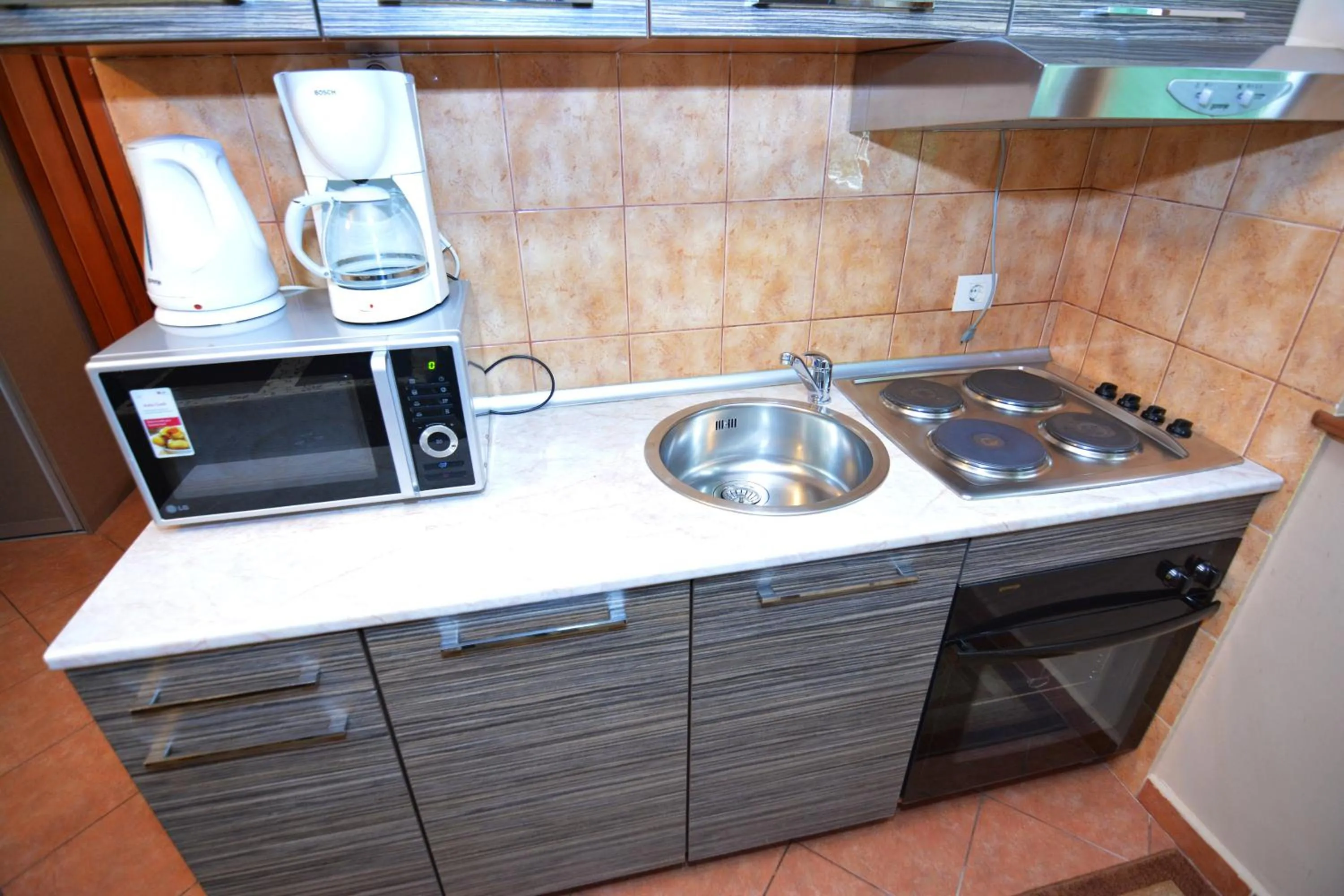 Kitchen or kitchenette in Apartments Bogdanovic