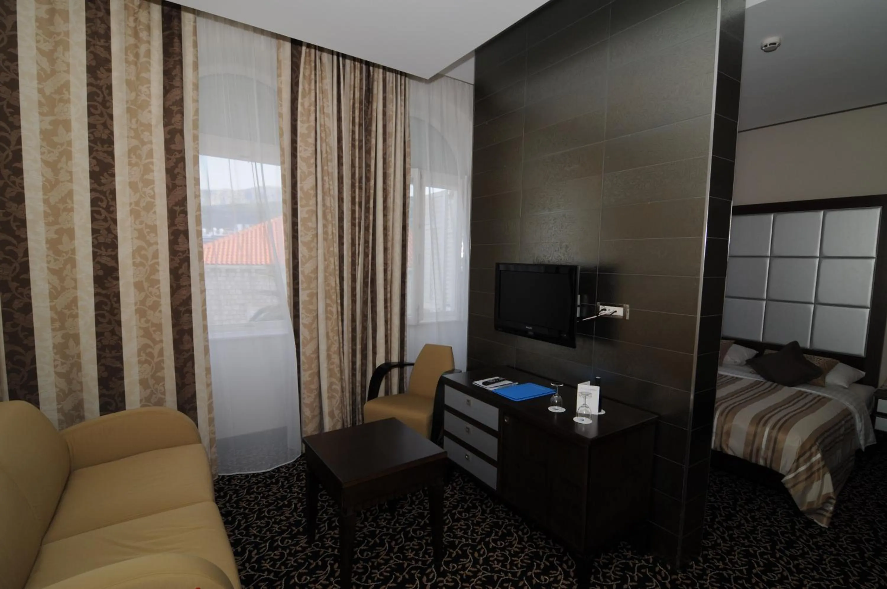 Living room, Bed in Hotel Lapad