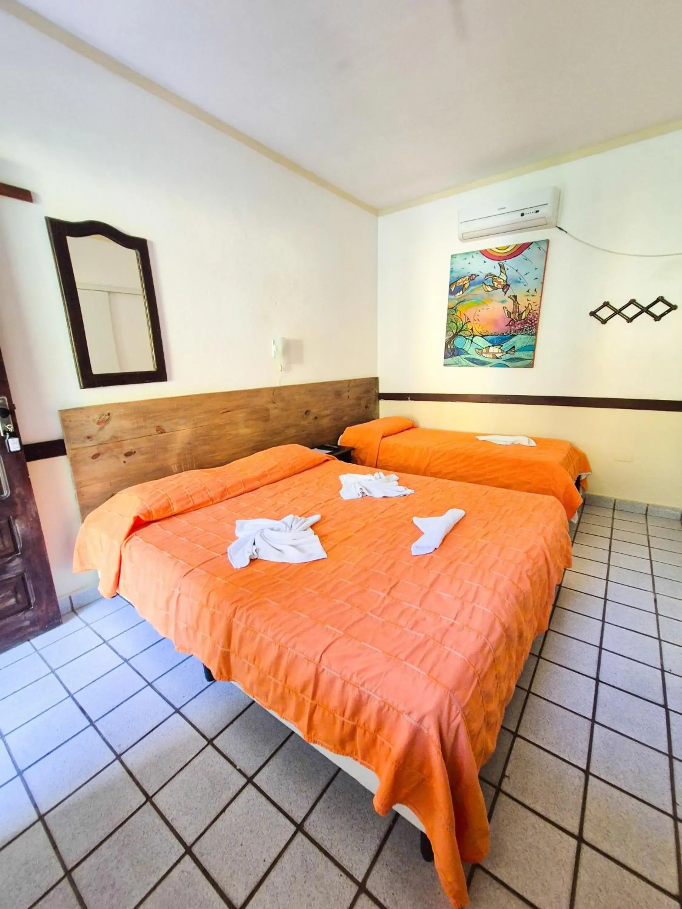 Triple Room in Aguamarinha Pousada Triple Room in Aguamarinha Pousada