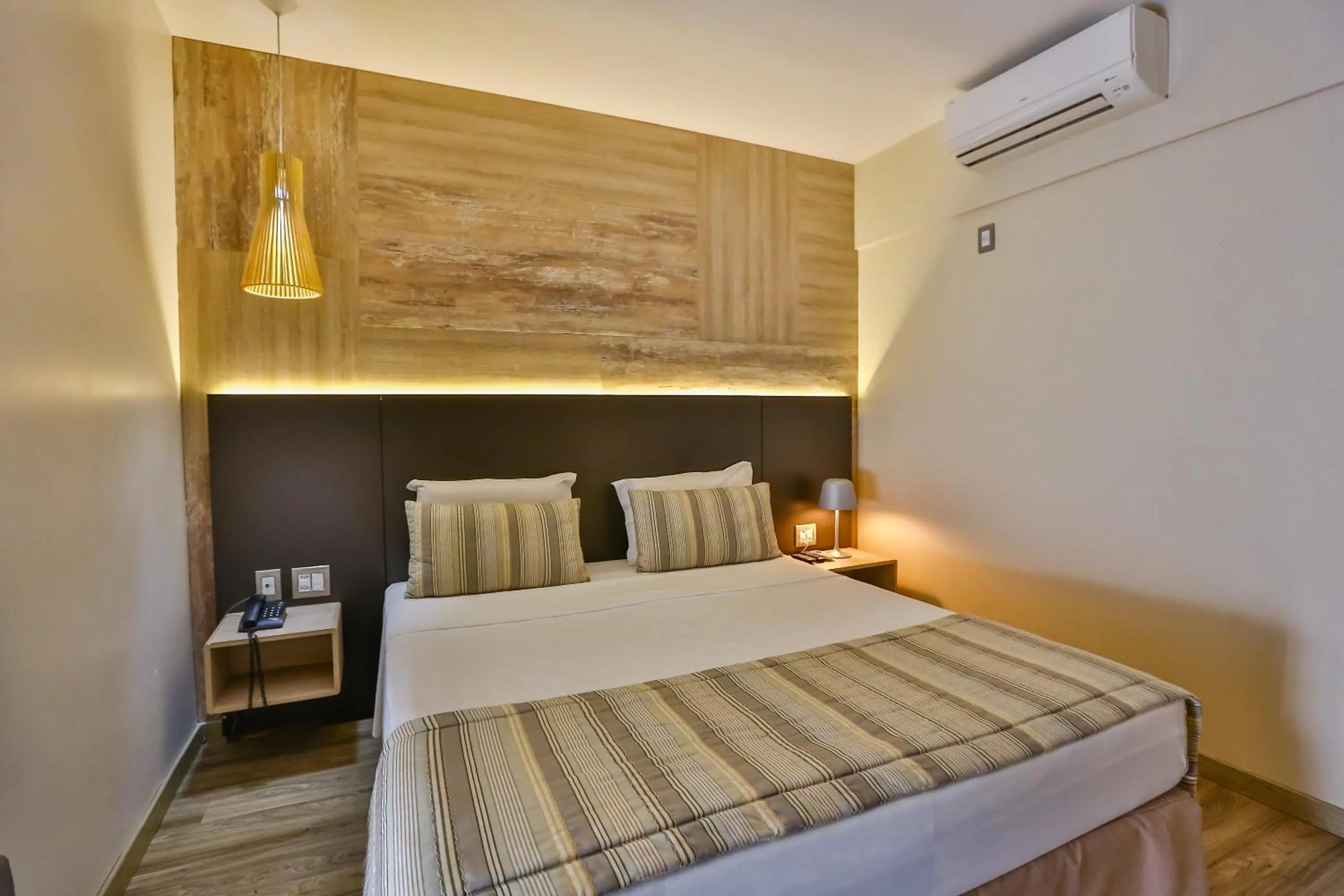 Bed in SAN MARINO SUITES HOTEL By NOBILE