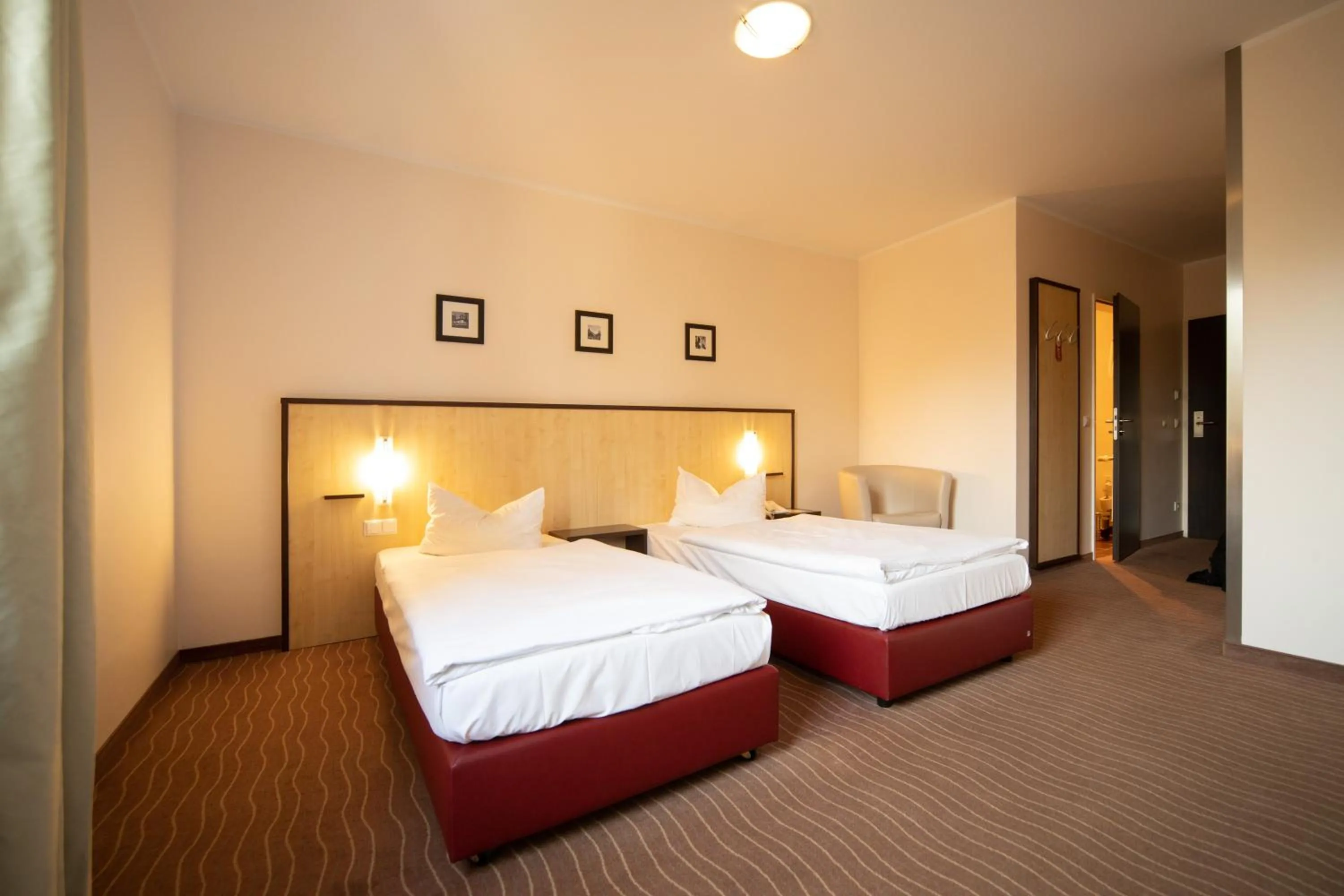 Photo of the whole room, Bed in Bergwirtschaft Wilder Mann Hotel und Restaurant