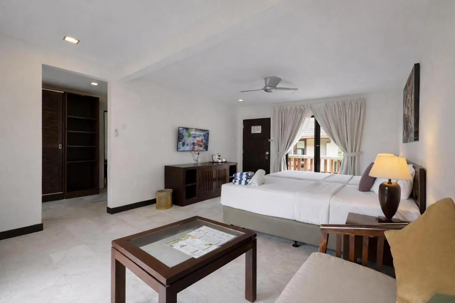 Bed in Frangipani Langkawi Resort