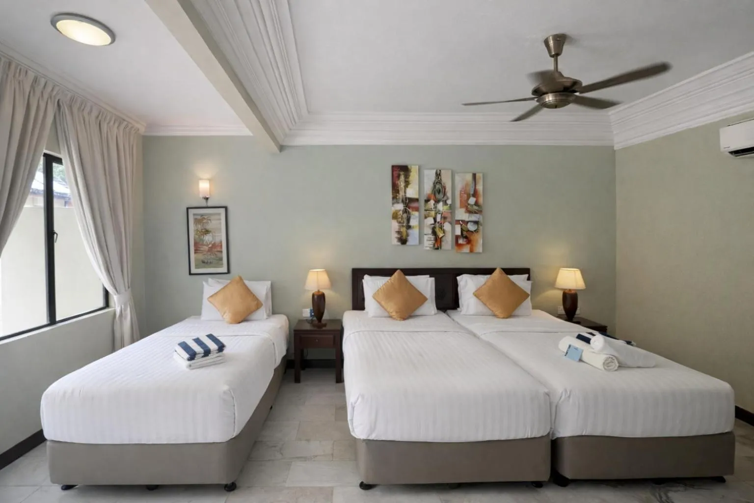 Bed in Frangipani Langkawi Resort