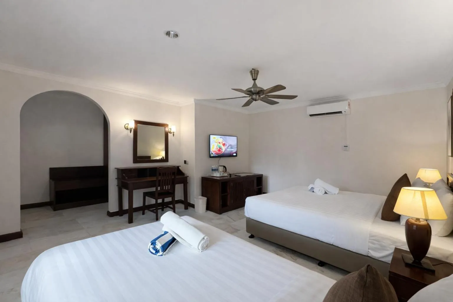 Bed in Frangipani Langkawi Resort