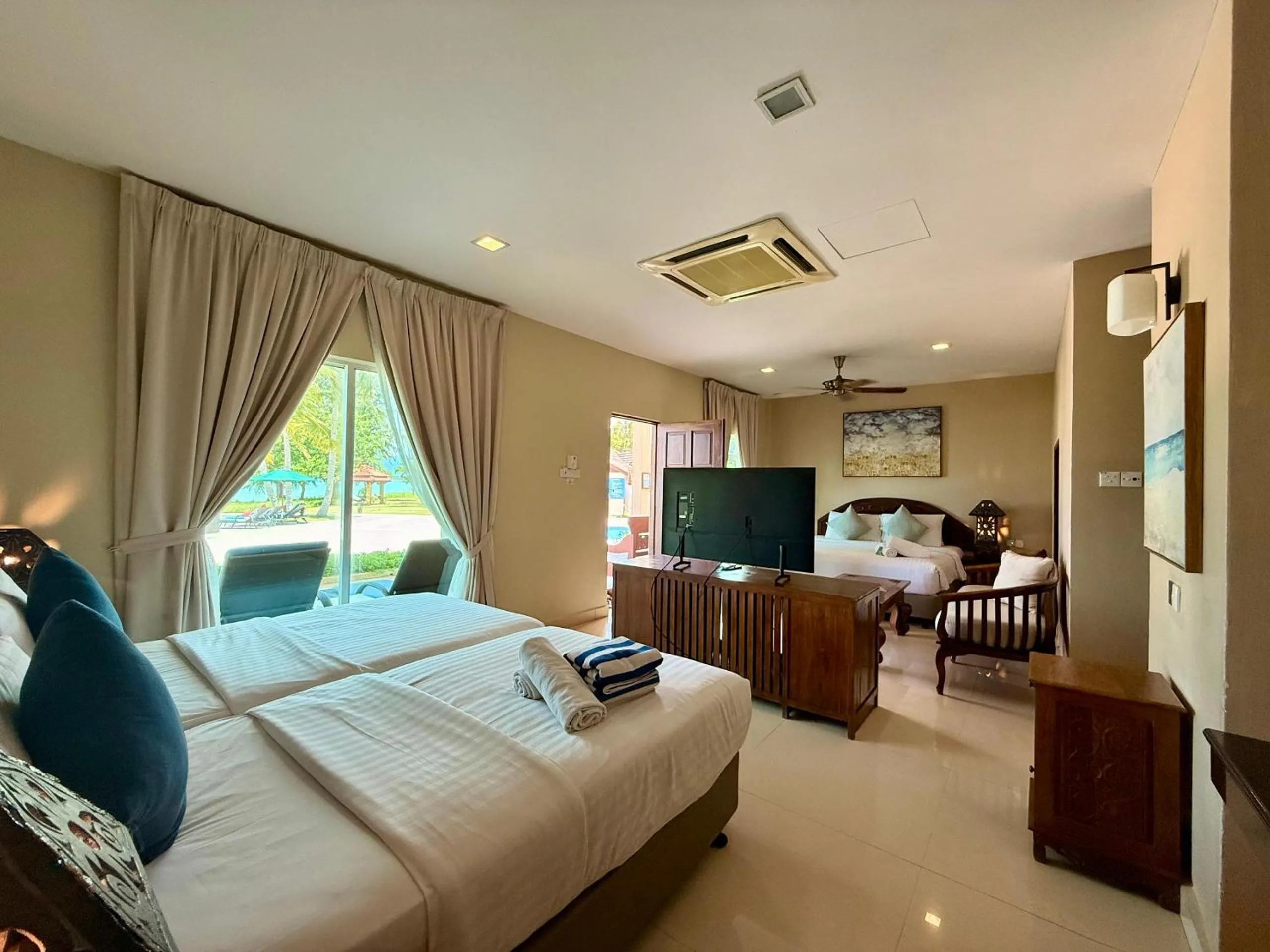 Bed in Frangipani Langkawi Resort