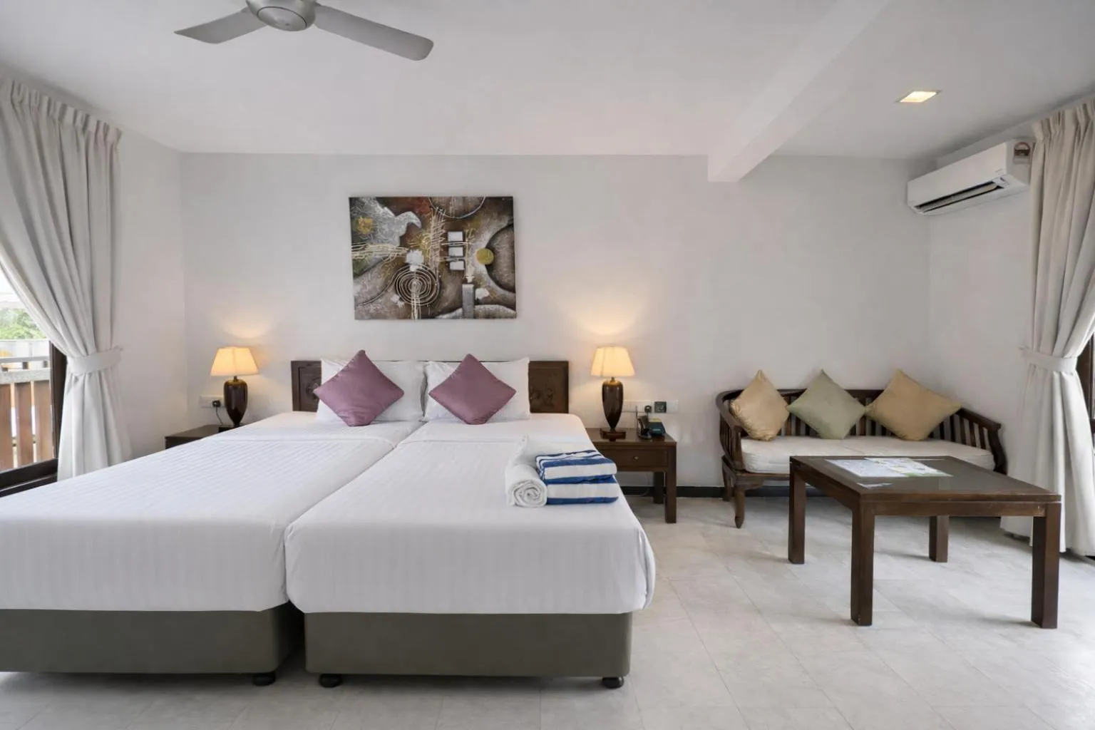 Bed in Frangipani Langkawi Resort