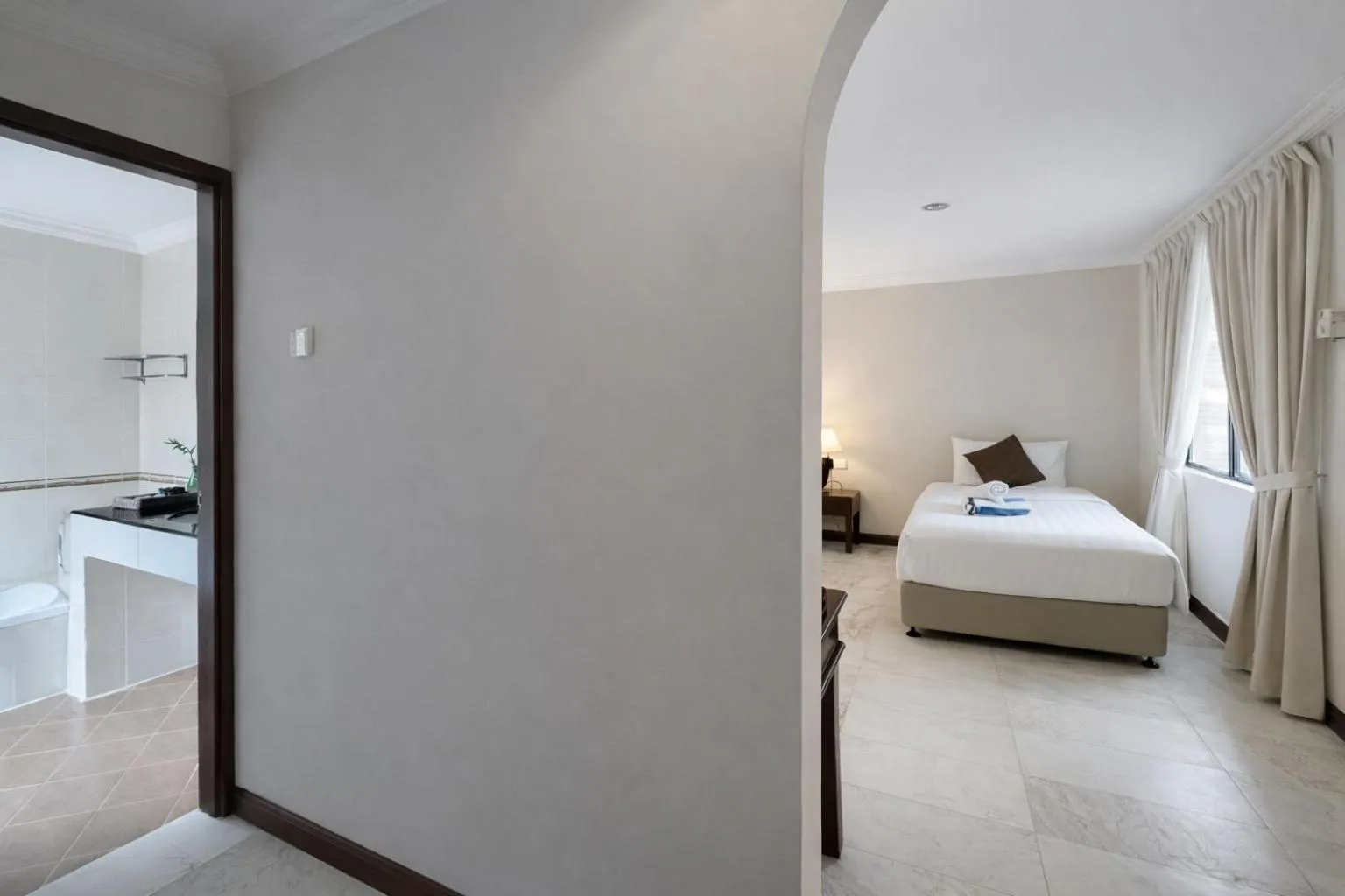 Bed in Frangipani Langkawi Resort