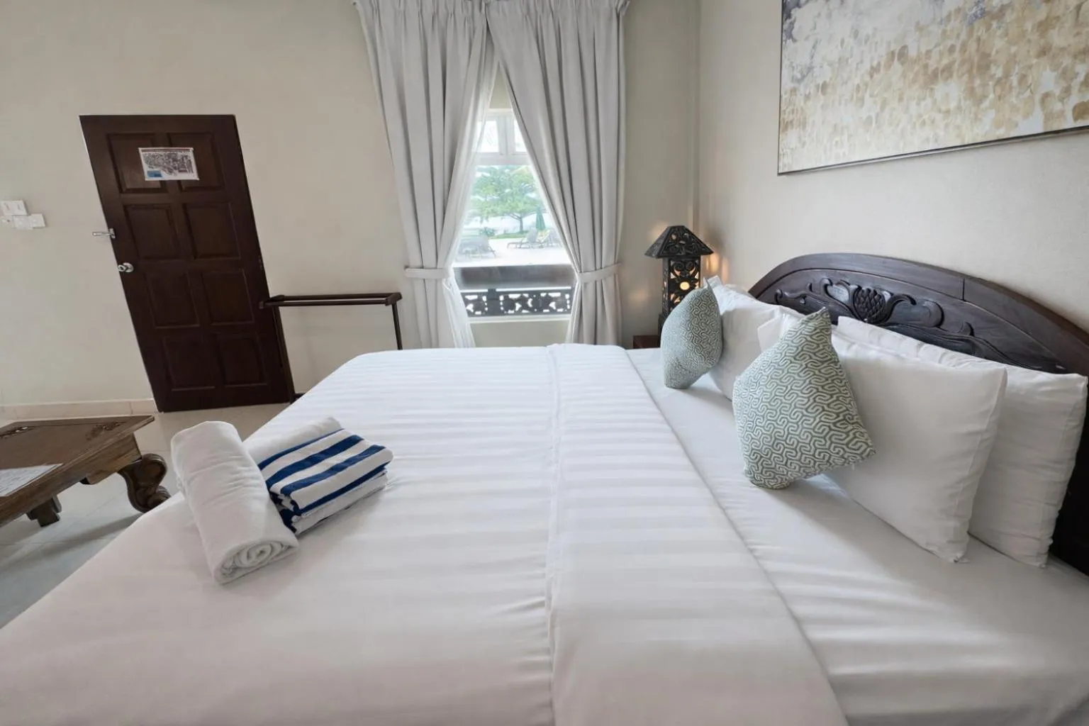 Bed in Frangipani Langkawi Resort