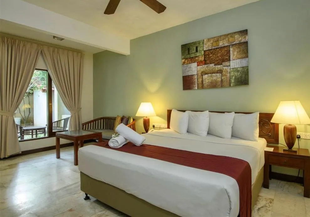 Bed in Frangipani Langkawi Resort