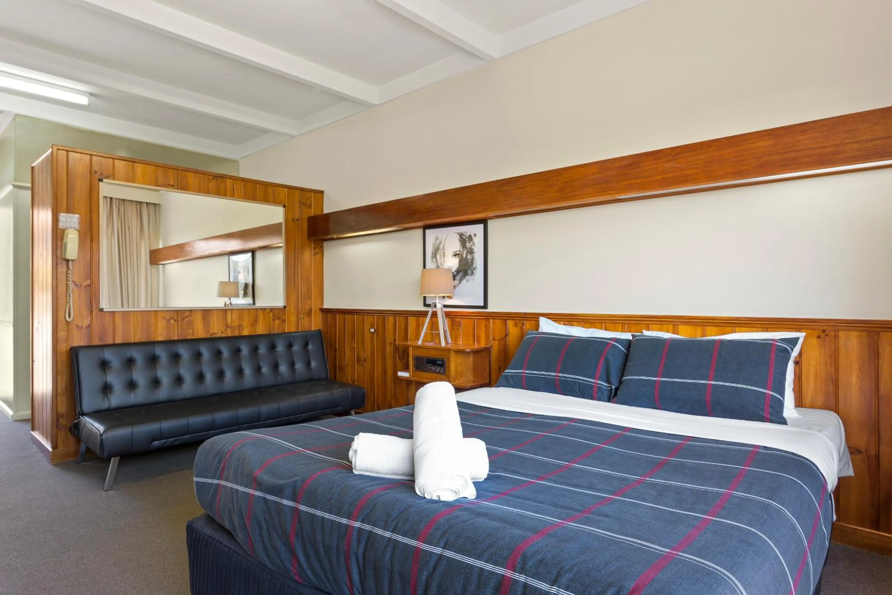 Bed in Village Family Motor Inn