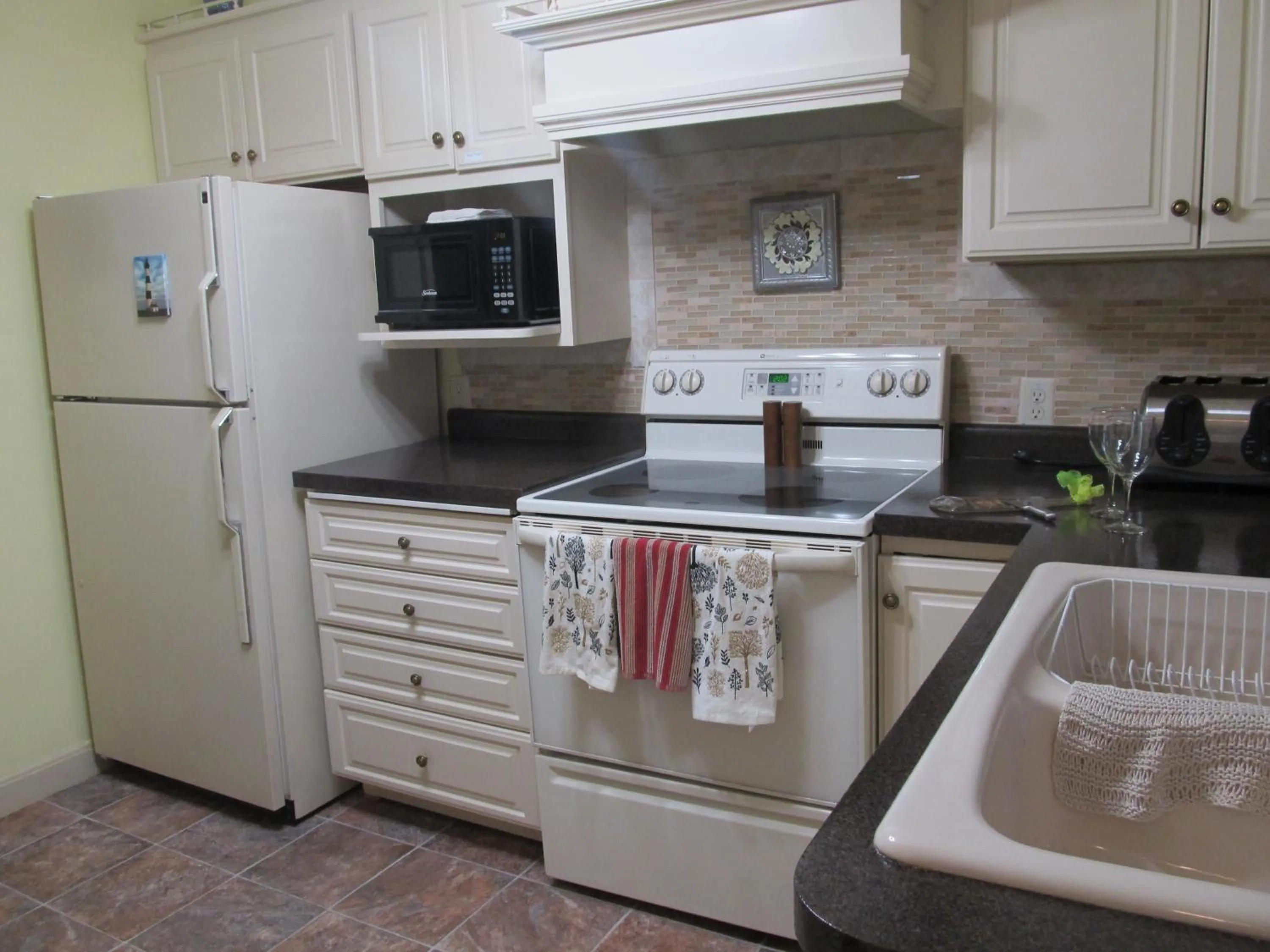 Kitchen or kitchenette in Covered By Faith Rentals -Storybook Home