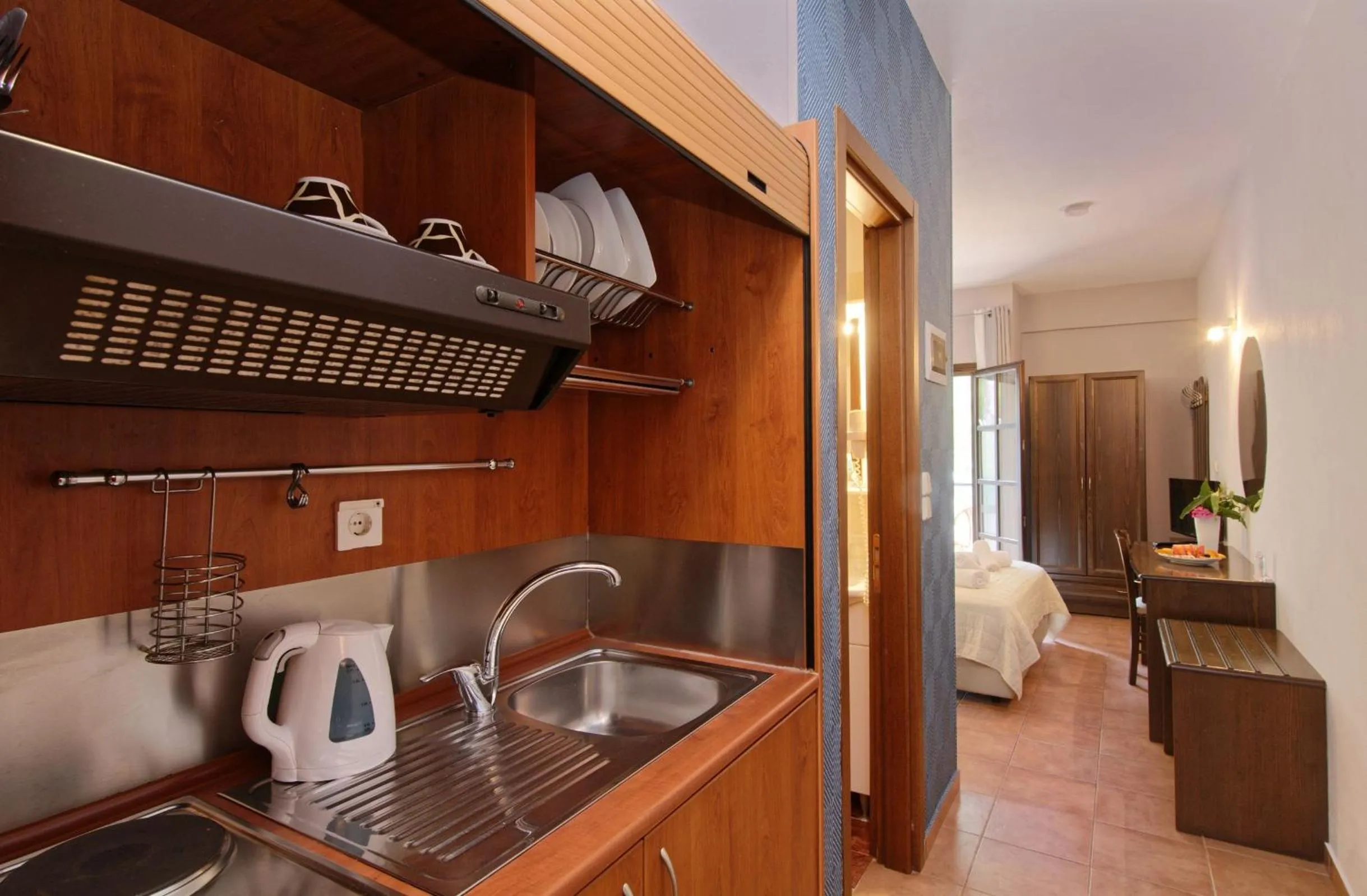 Kitchen or kitchenette, Bed in Enalion Hotel