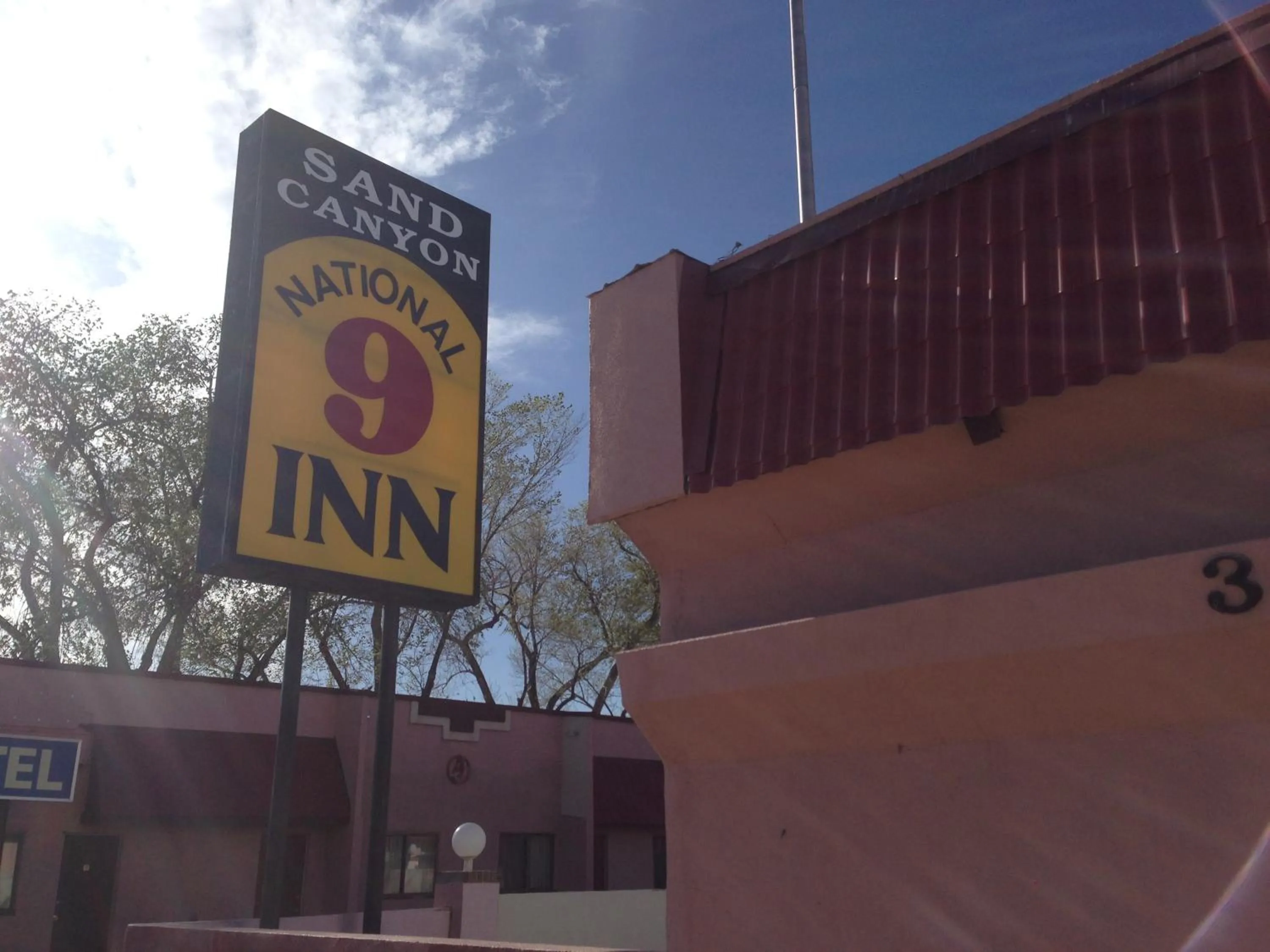 Property logo or sign in National 9 Inn Sand Canyon