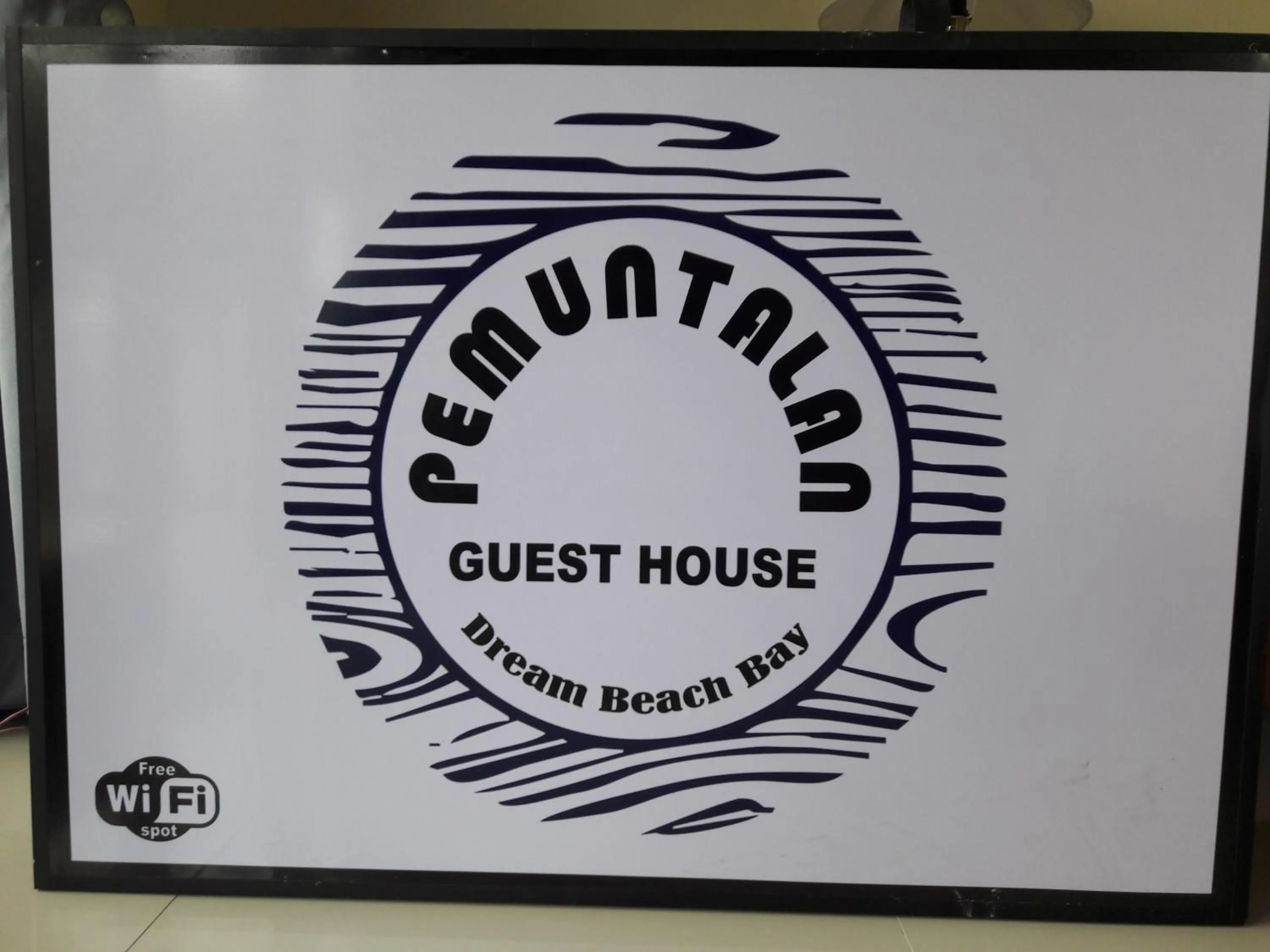 Property logo or sign in Pemuntalan Guesthouse