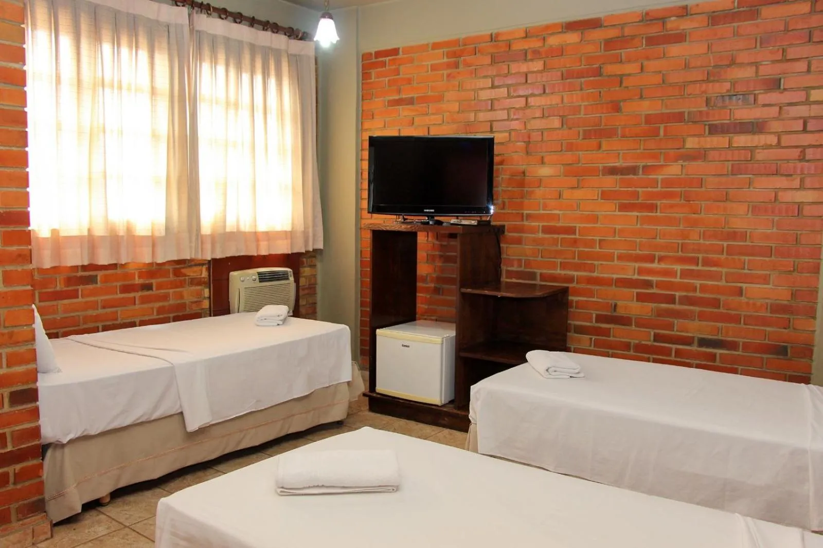 Photo of the whole room, Bed in Rede Andrade Goiania Centro