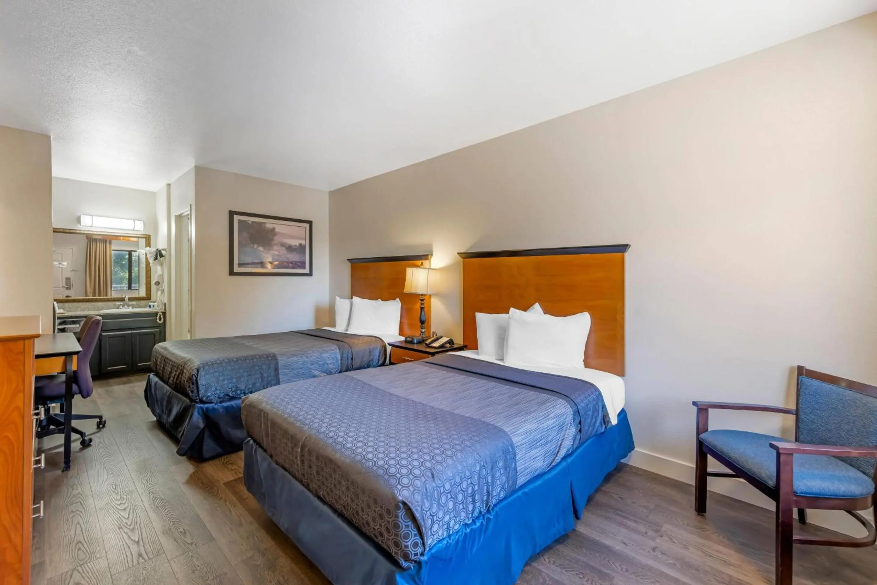 Bedroom, Bed in Rodeway Inn at Nevada State Capitol