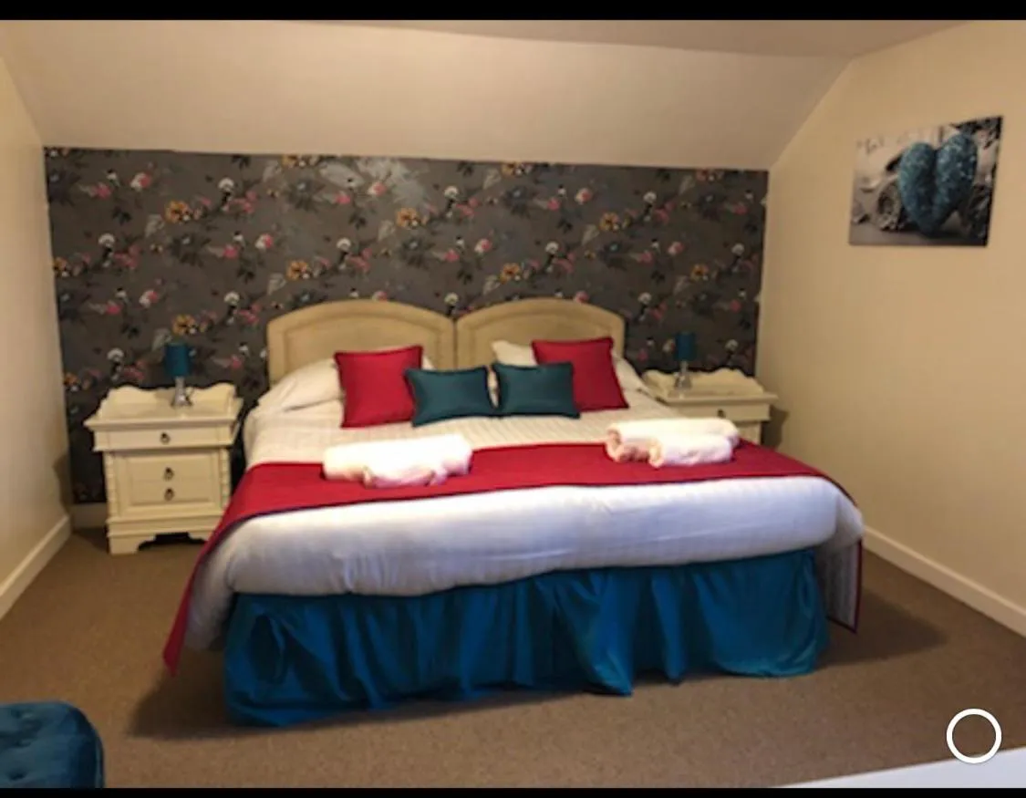 Bed in The Jug & Glass Inn