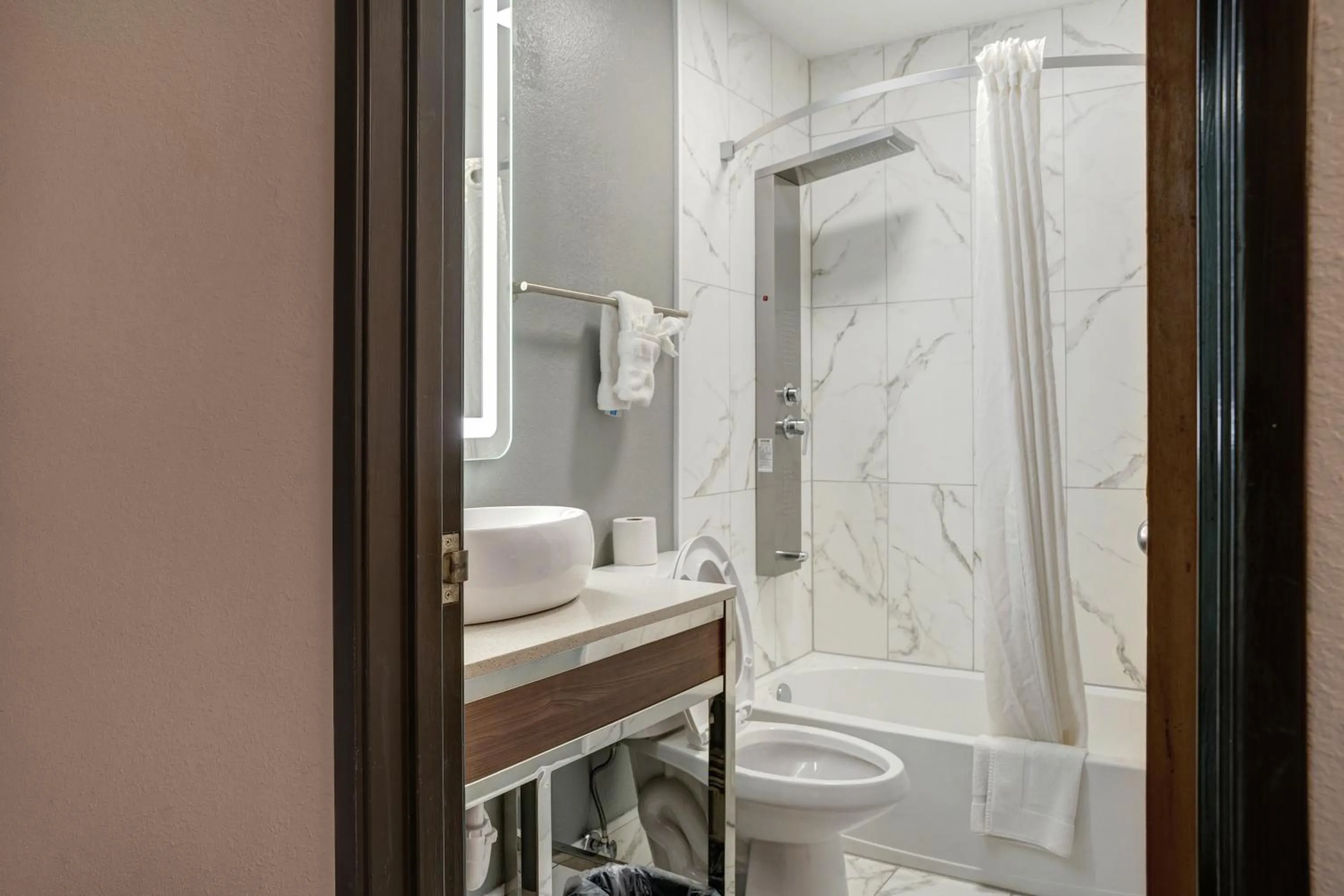 Bathroom in Days Inn by Wyndham Omaha - West Dodge