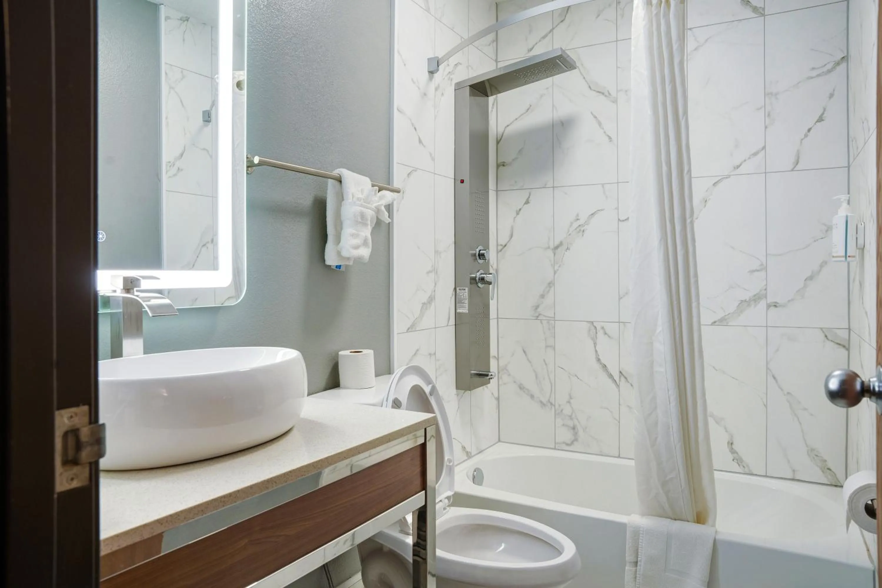 Bathroom in Days Inn by Wyndham Omaha - West Dodge