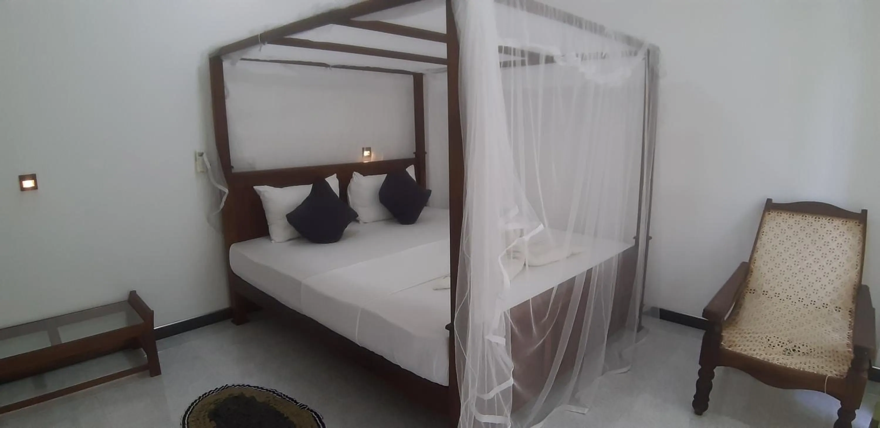 Bed in Butterfly Homestead Hotel