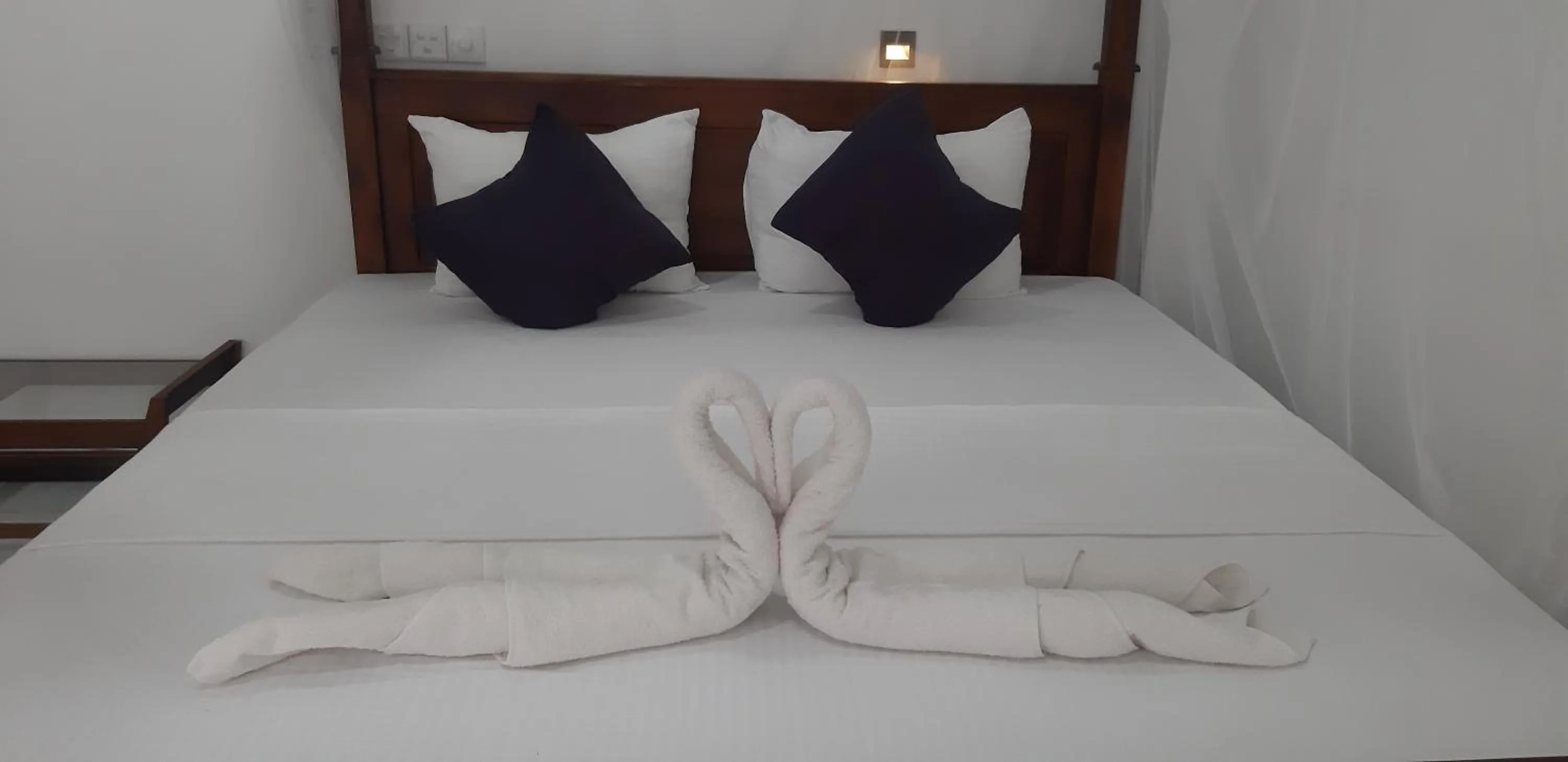 Bed in Butterfly Homestead Hotel