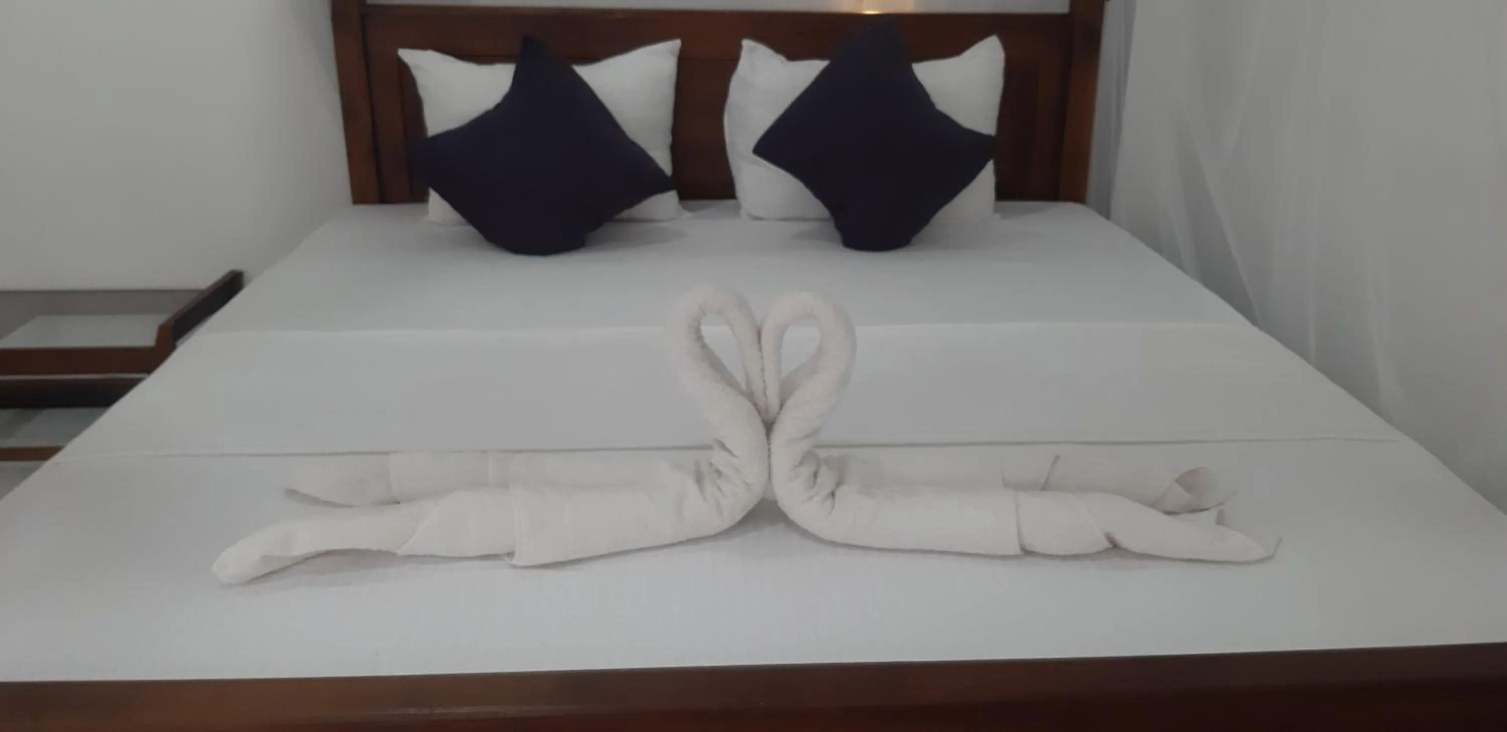 Bed in Butterfly Homestead Hotel